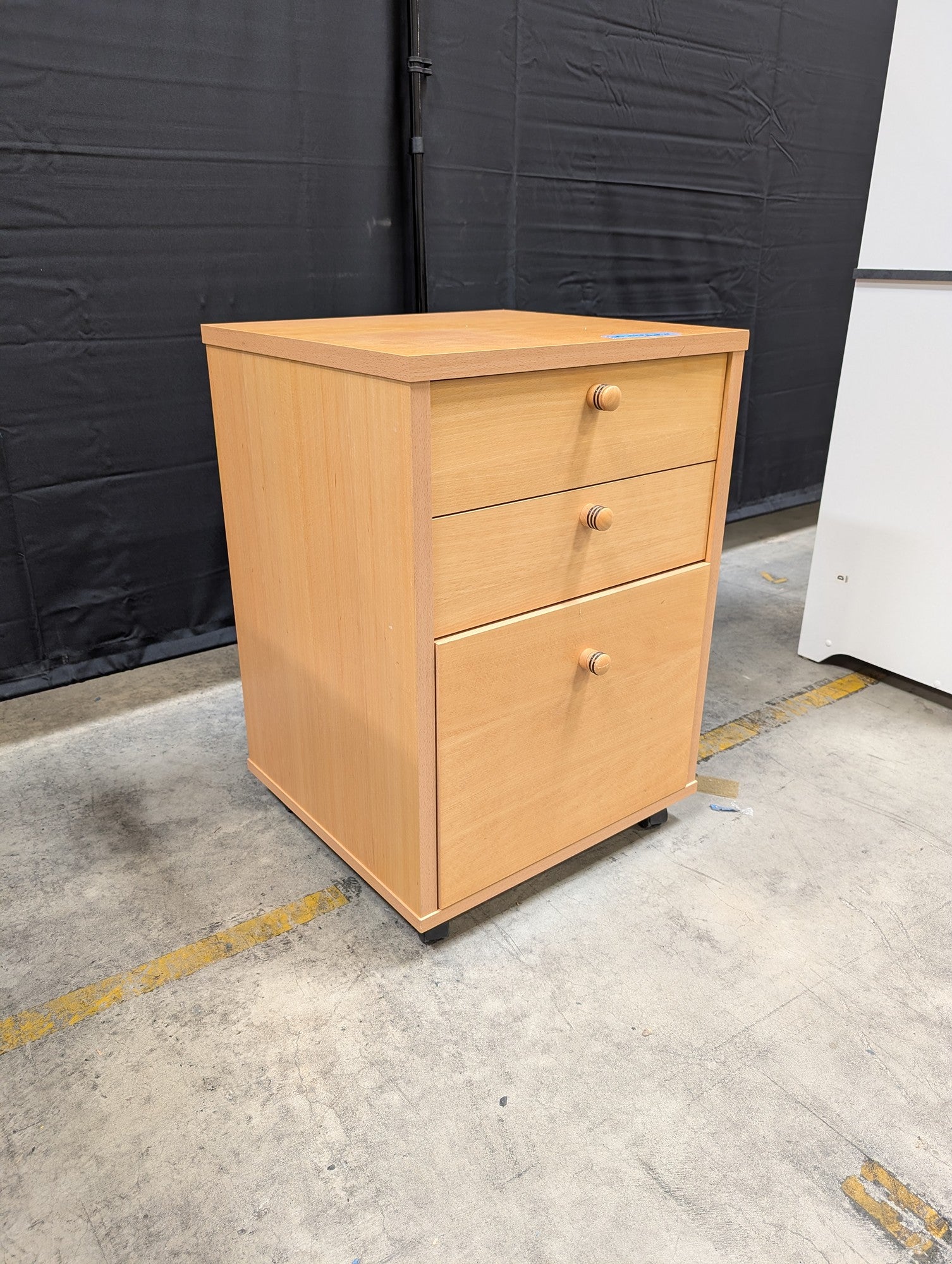 Light Wood Three-Drawer Storage Cabinet with Casters