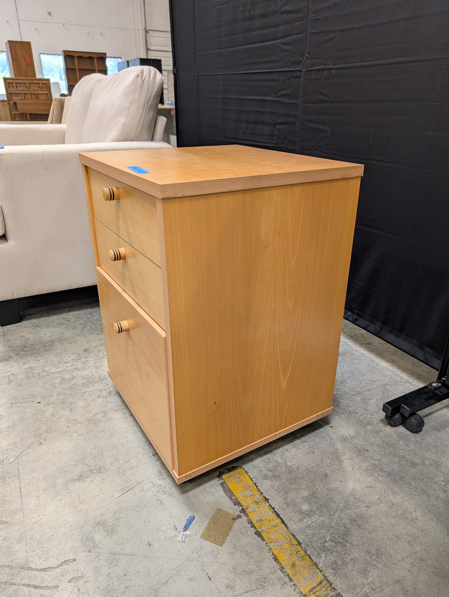 Light Wood Three-Drawer Storage Cabinet with Casters