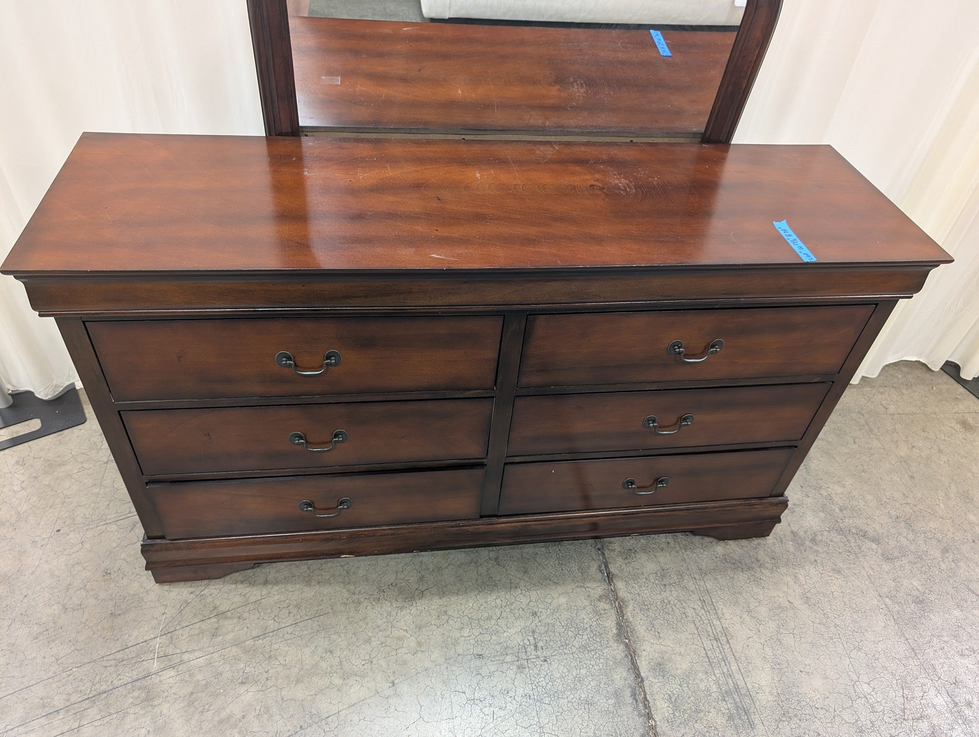 Dark Wood Six-Drawer Dresser with Rounded Mirror
