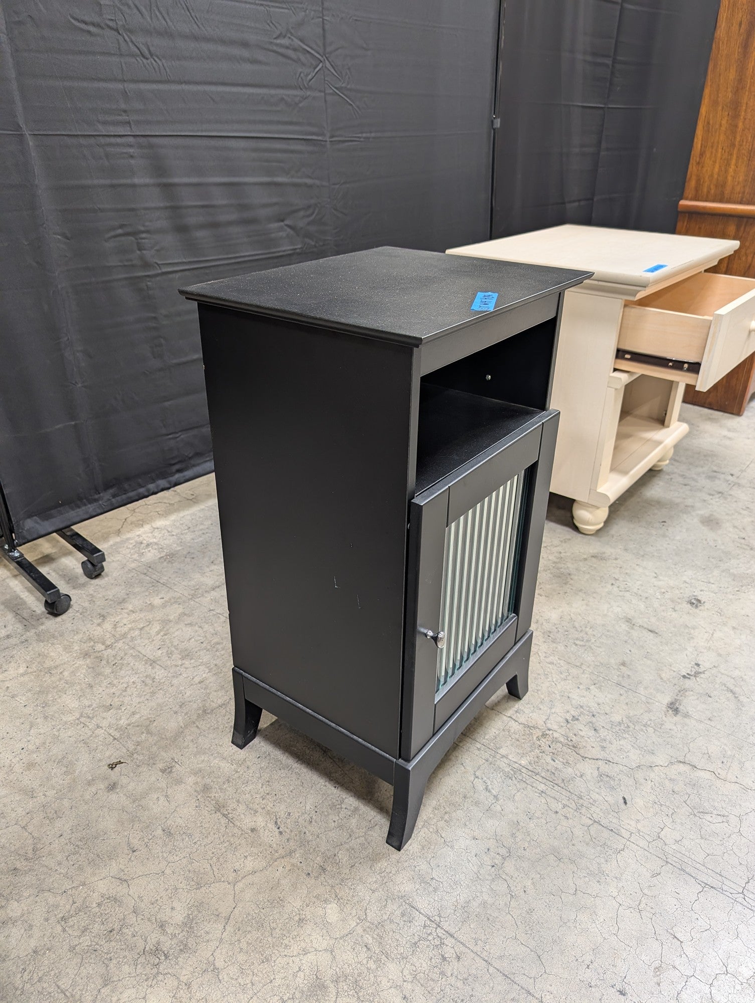 Black Wood Nightstand with Ribbed Panel Door
