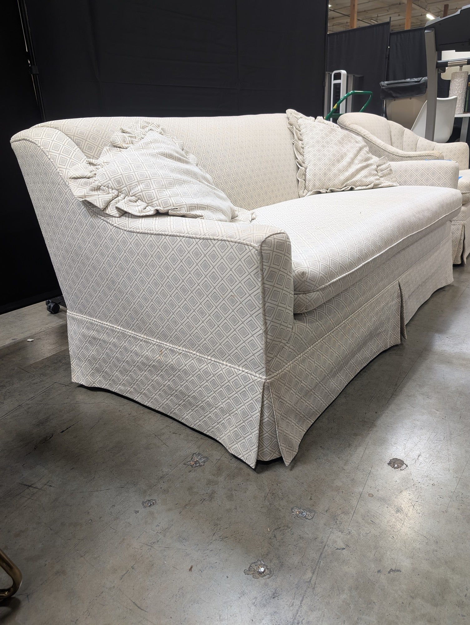 Neutral Patterned Upholstered Loveseat with Skirted Base
