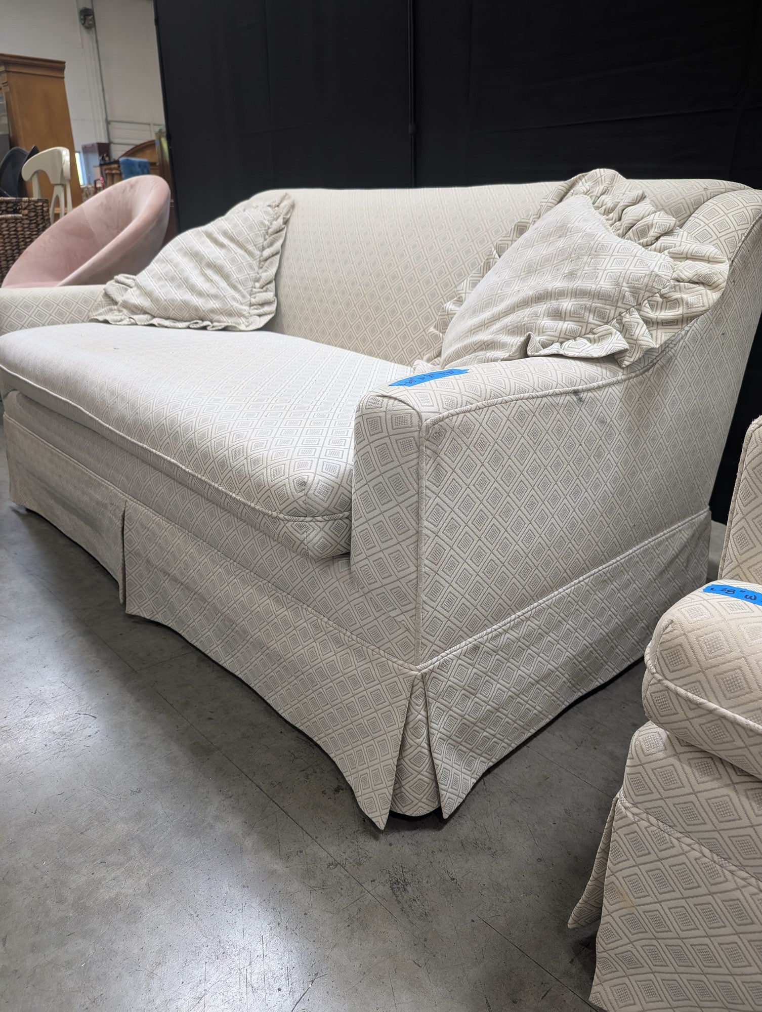 Neutral Patterned Upholstered Loveseat with Skirted Base