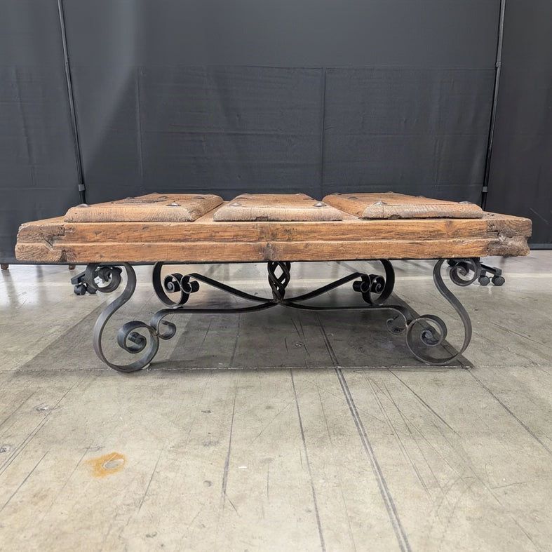 Rustic Plank Top Wood Coffee Table with Ornate Iron Base