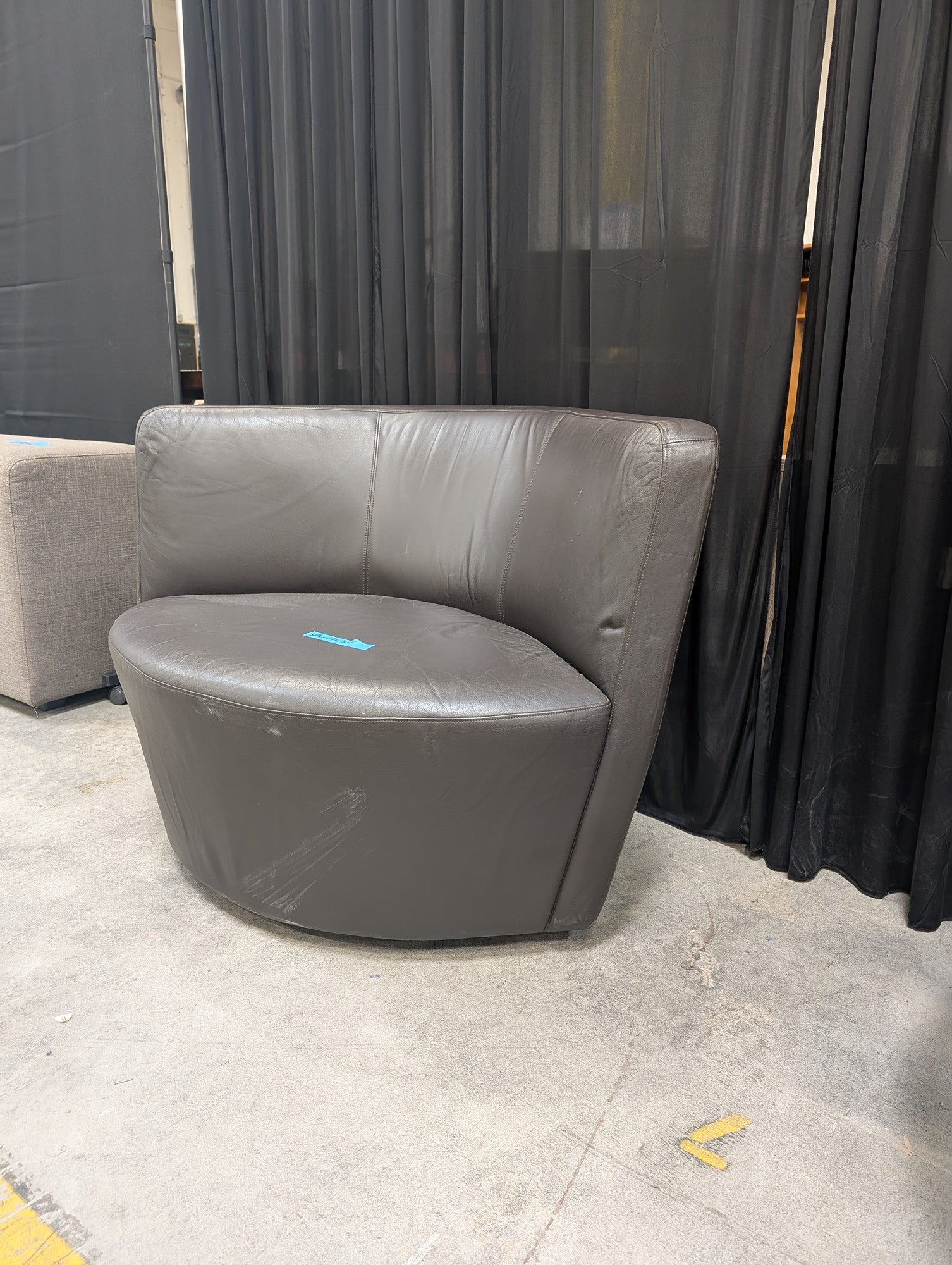 Curved Grey Leather Armless Accent Chair