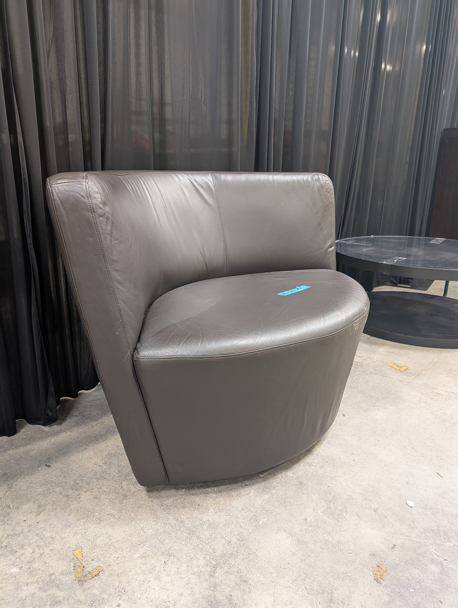 Curved Grey Leather Armless Accent Chair