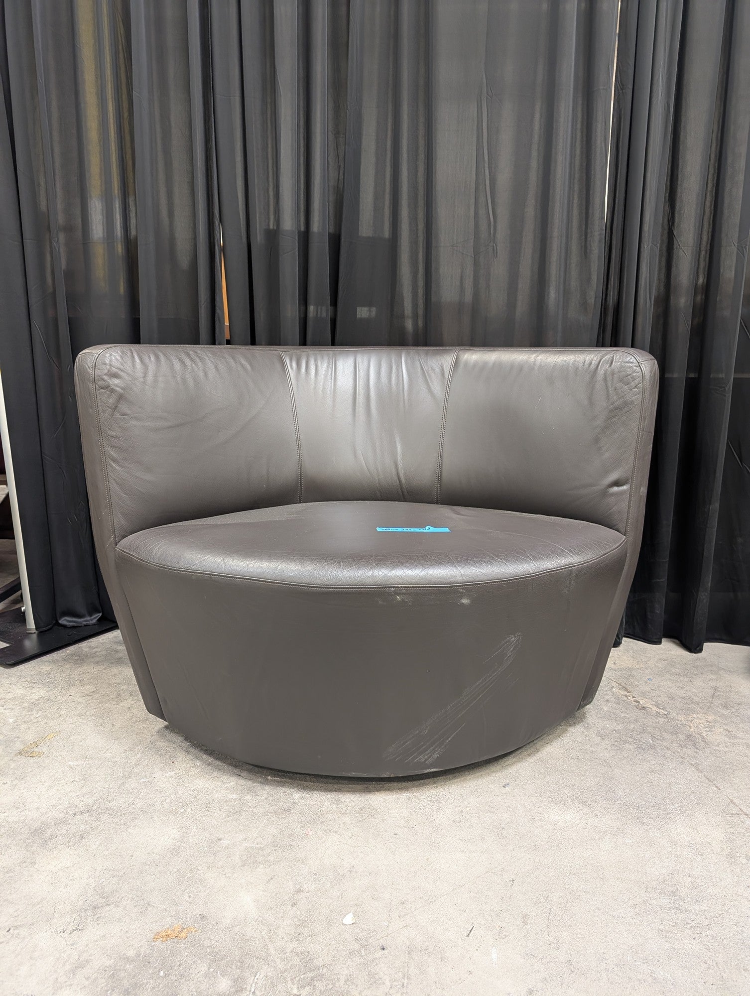 Curved Grey Leather Armless Accent Chair