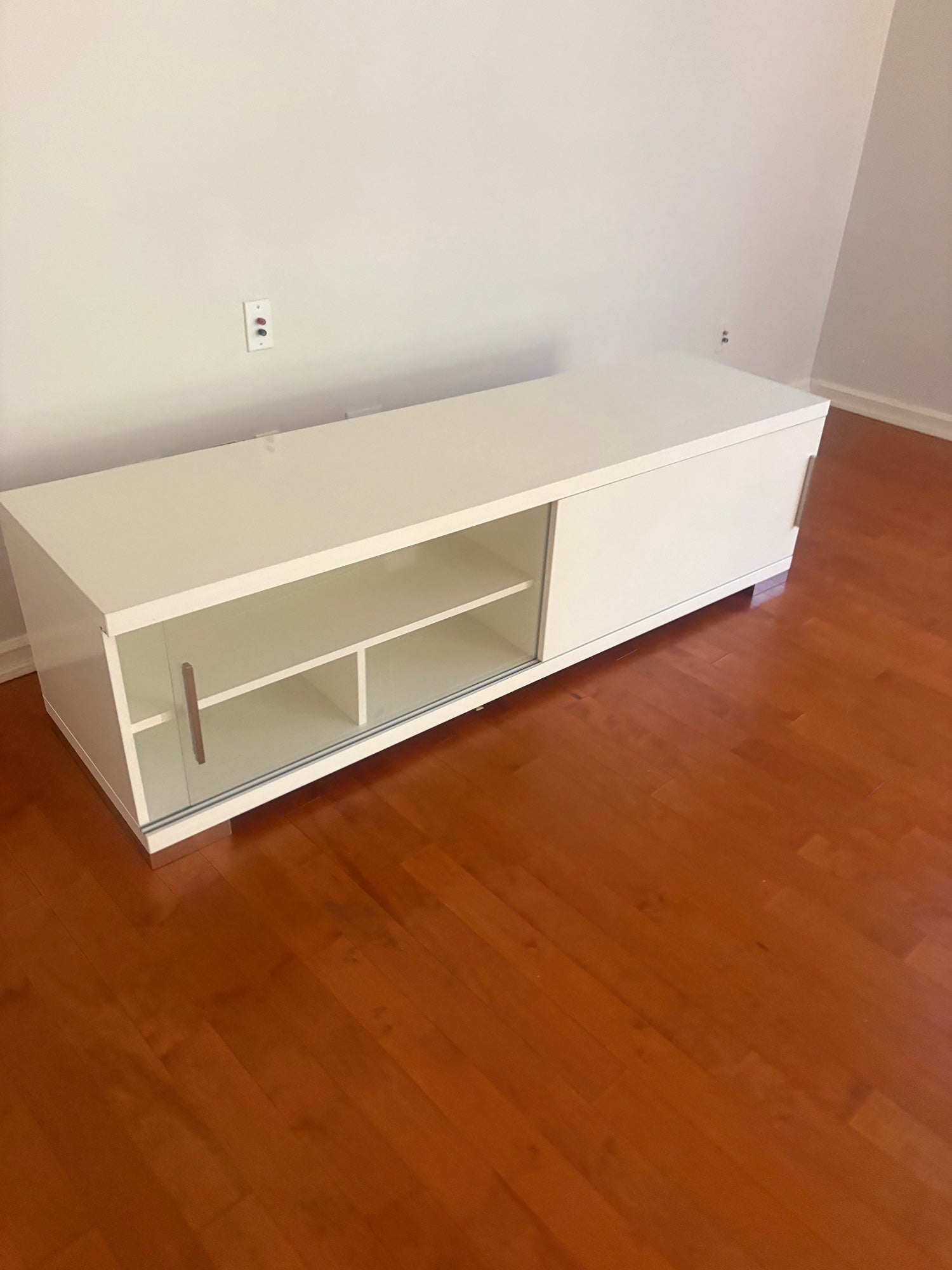 Sleek White Entertainment Unit with Sliding Doors