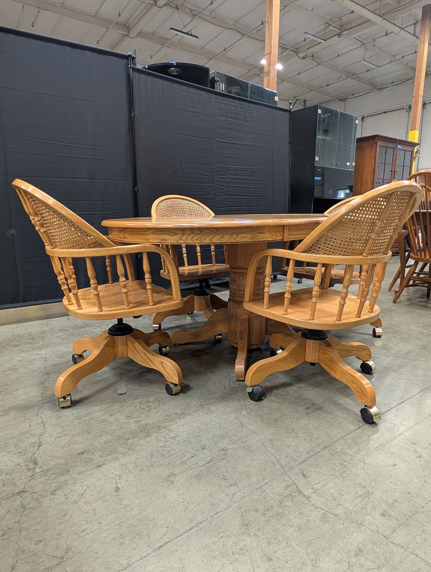 Set with Four Cane Back A-America Furniture Chairs with a Oval Wood Dining Table