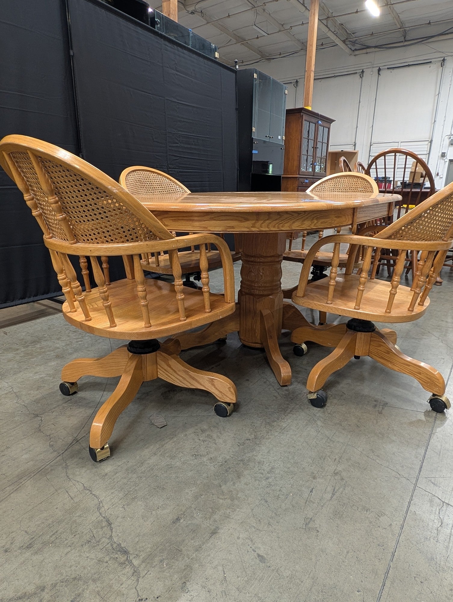 Set with Four Cane Back A-America Furniture Chairs with a Oval Wood Dining Table