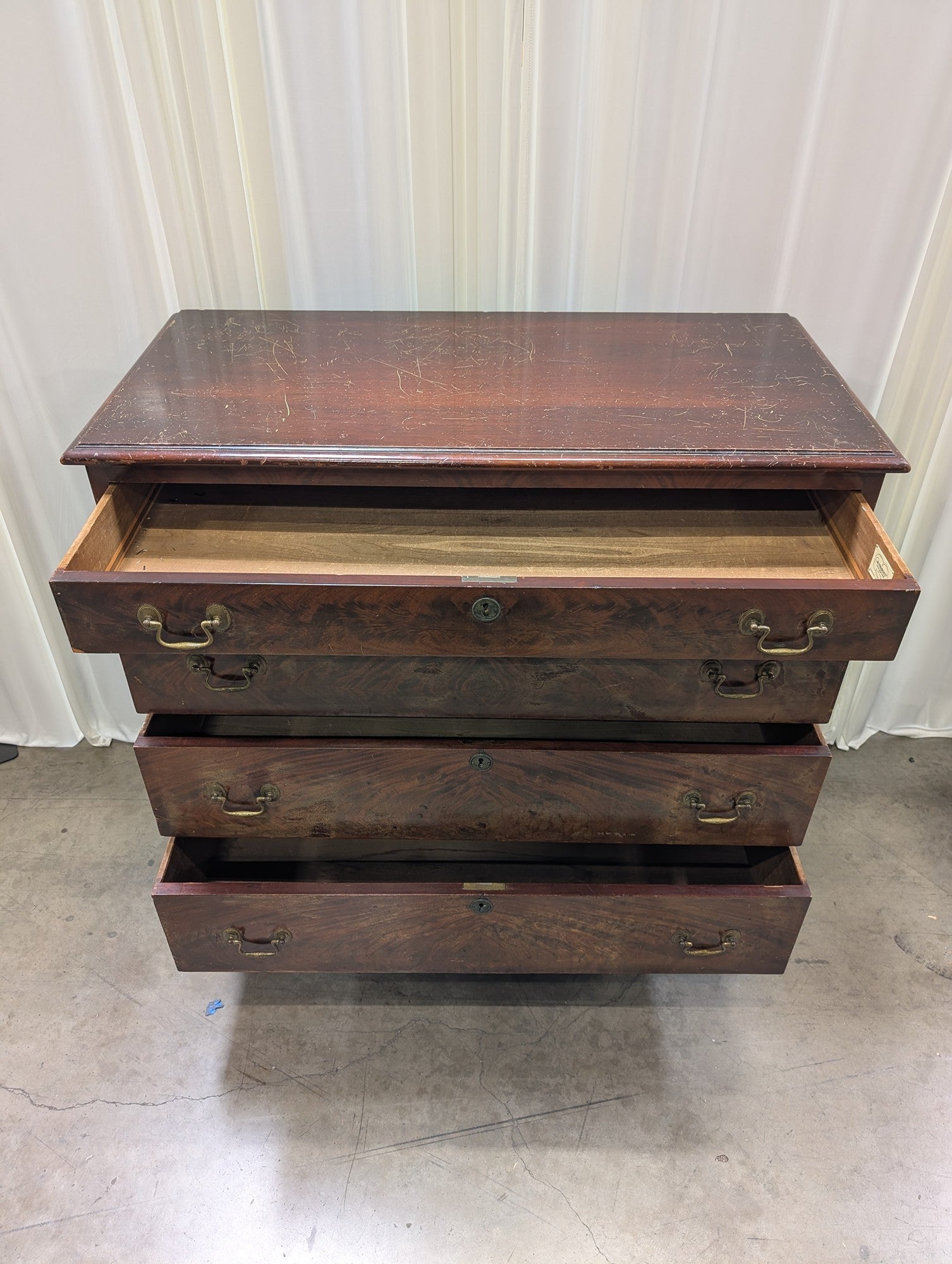 Hathaway's Dark Wood Four-Drawer Dresser with Ornate Hardware