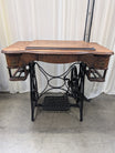Antique NEW HOME Wood Sewing Machine Cabinet with Ornate Cast Iron Base