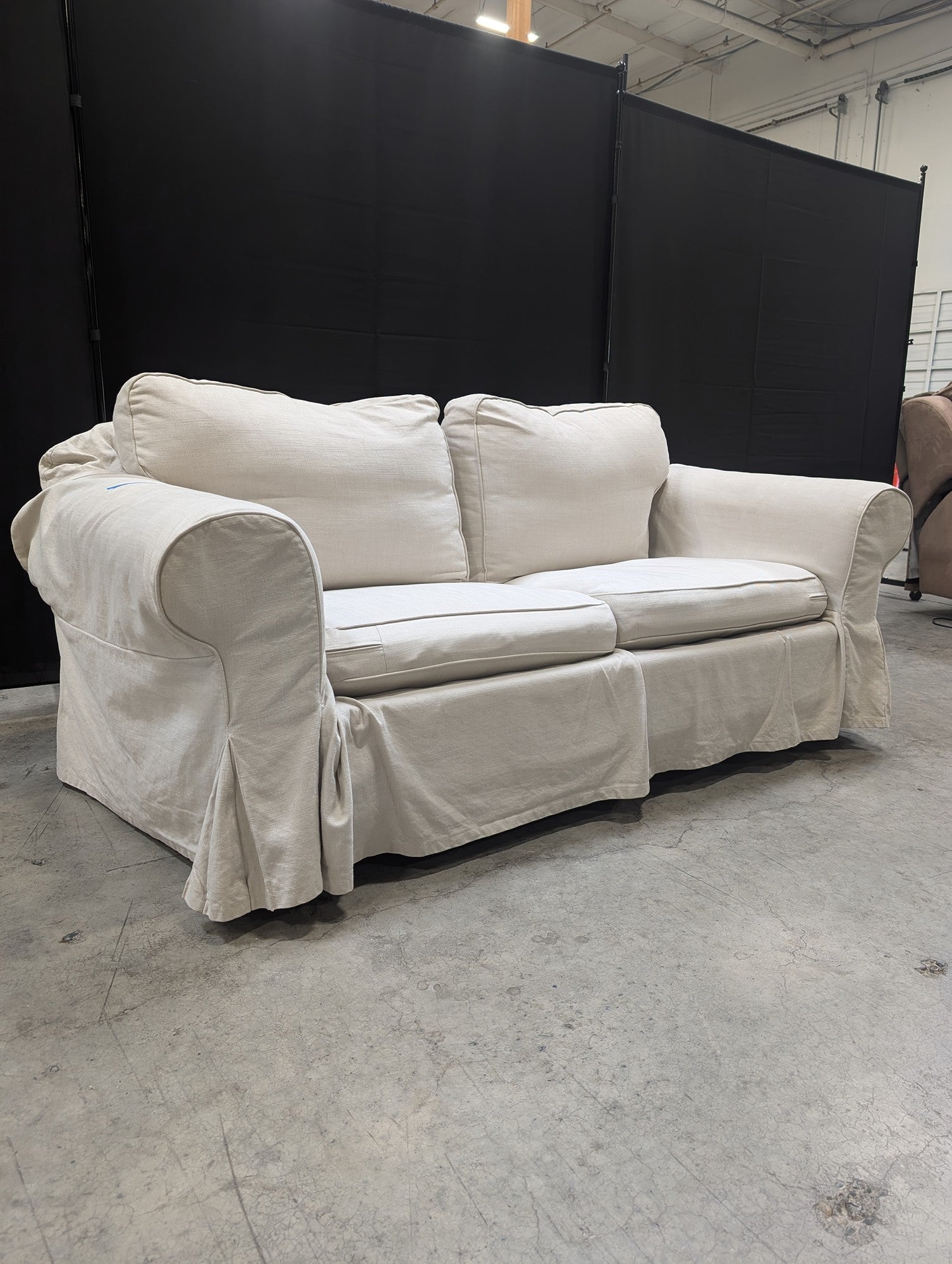 Light Beige Slipcovered Rolled Arm Couch