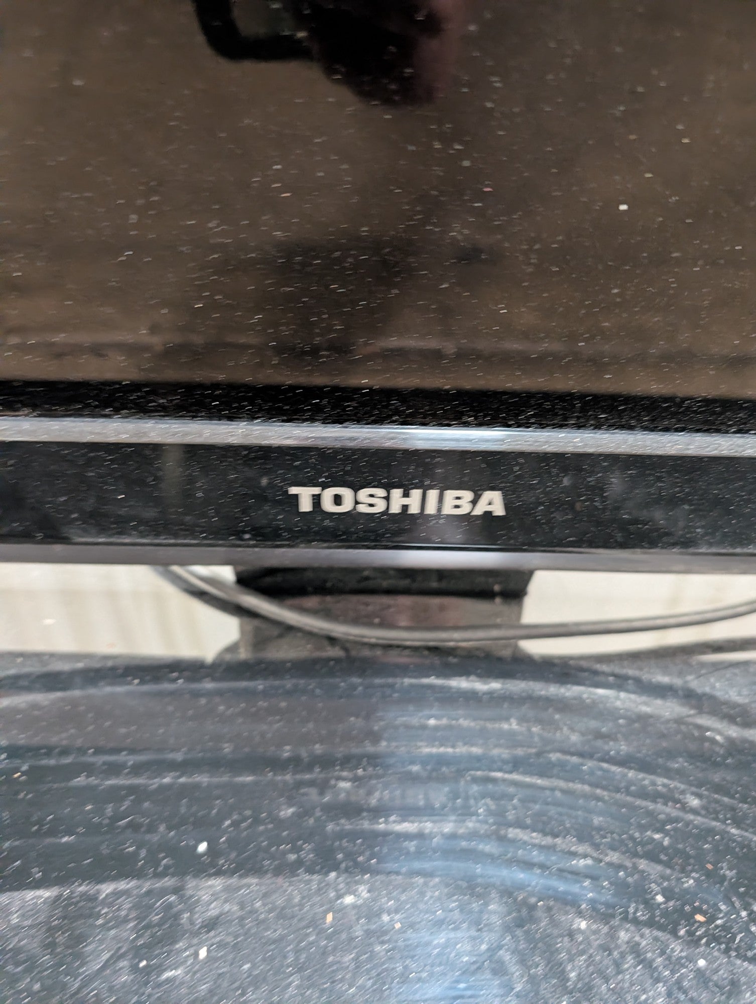Toshiba Black Flat Screen Television with Stand