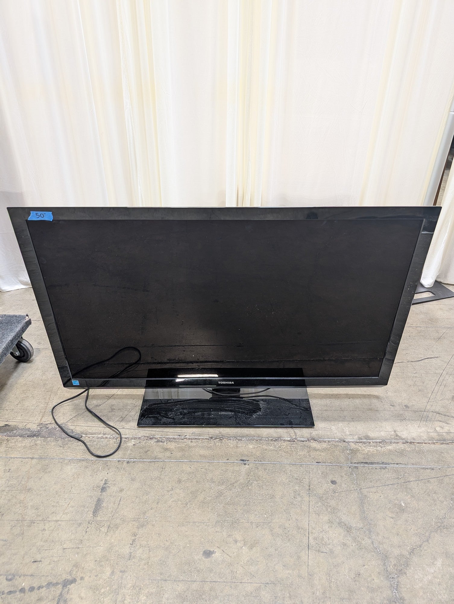Toshiba Black Flat Screen Television with Stand
