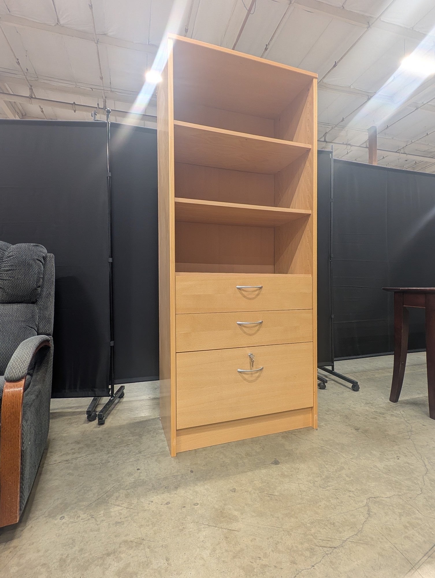 Versatile Light Wood Bookcase with Three Drawers