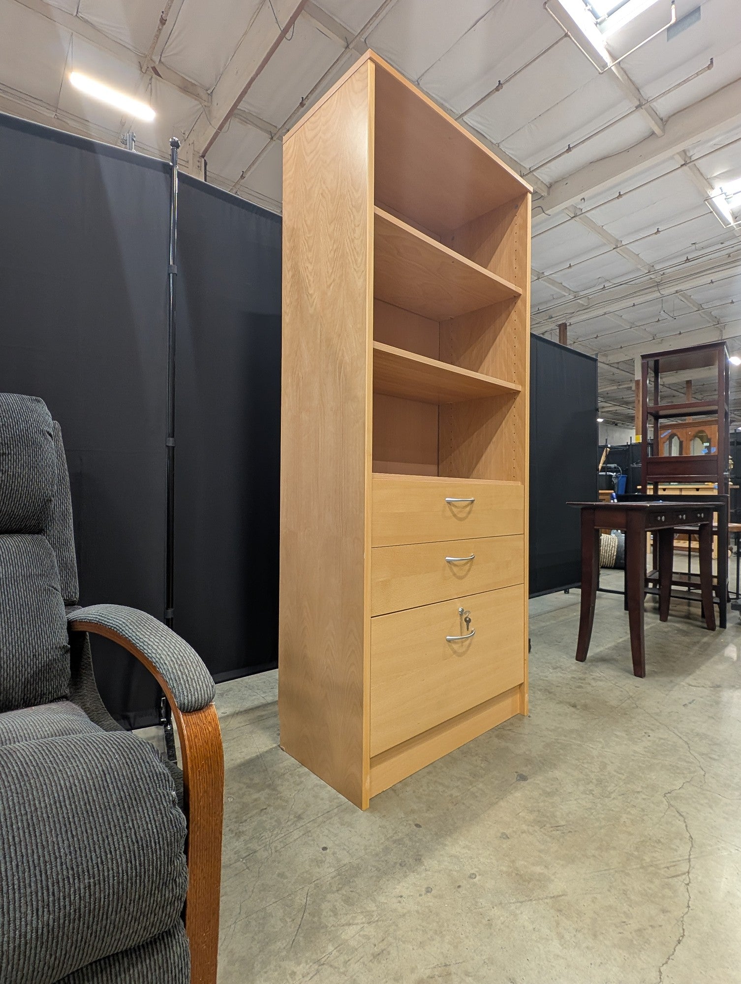 Versatile Light Wood Bookcase with Three Drawers