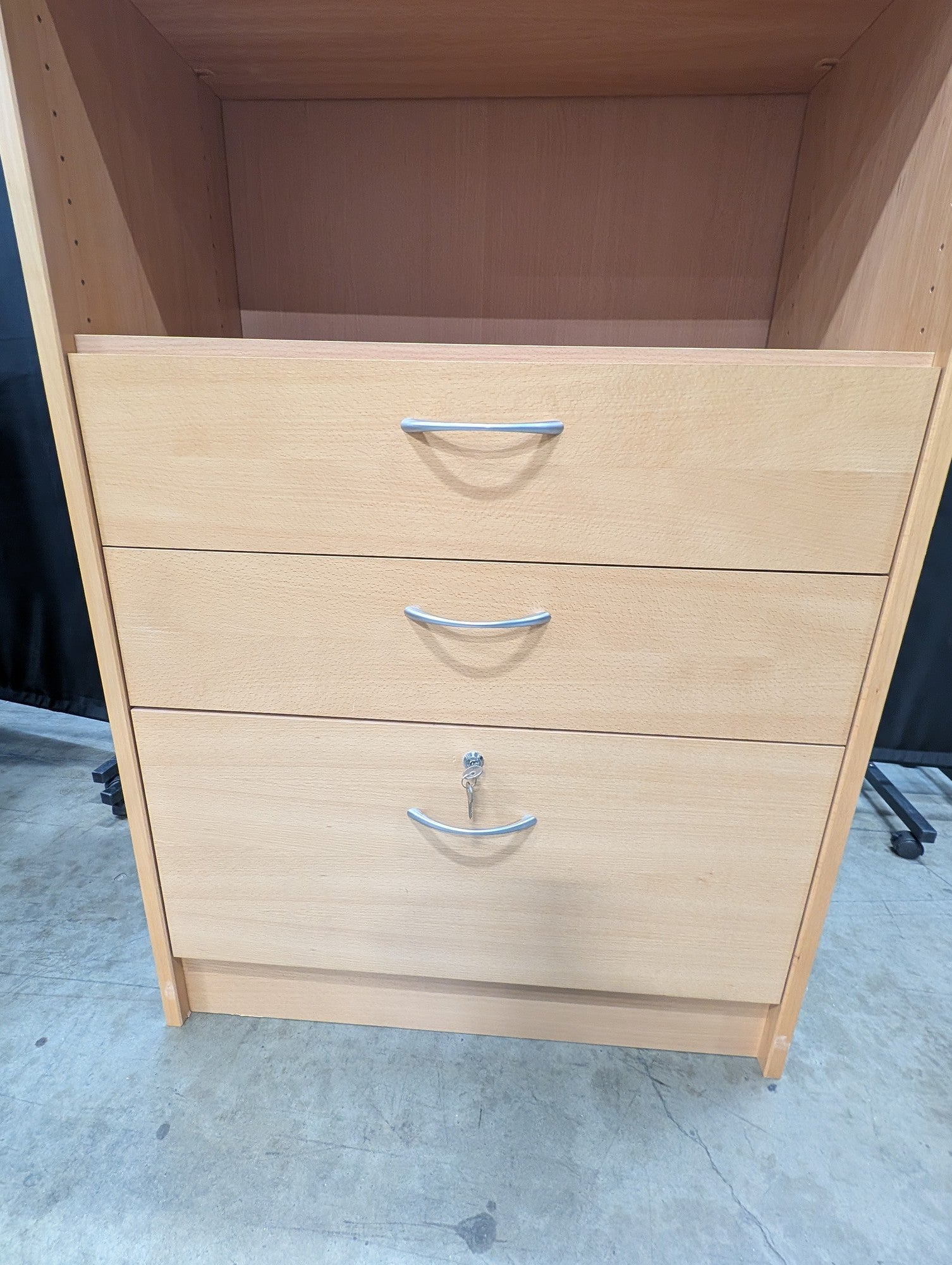 Versatile Light Wood Bookcase with Three Drawers