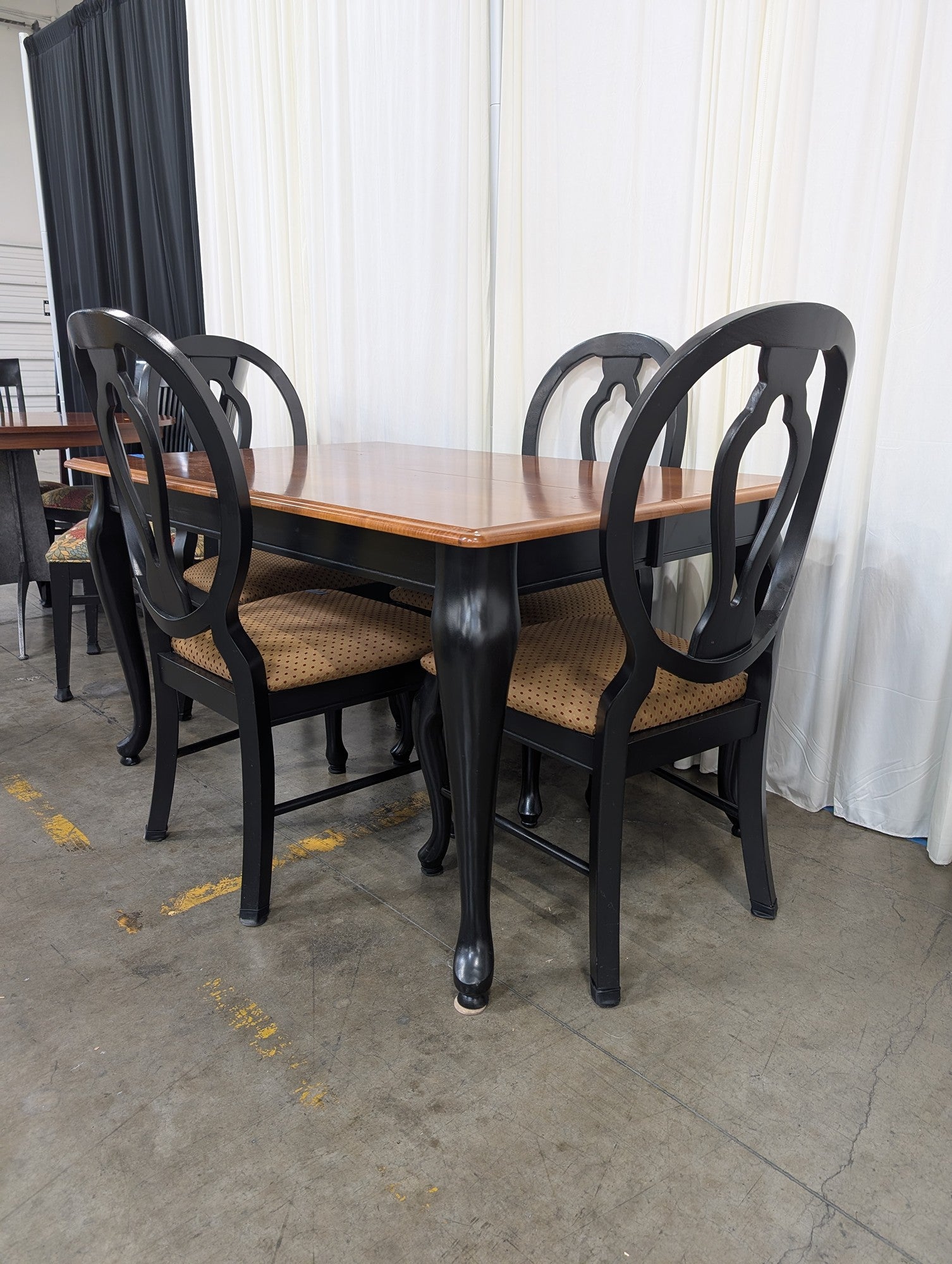 Two-Tone Wood Dining Table with Black Chairs