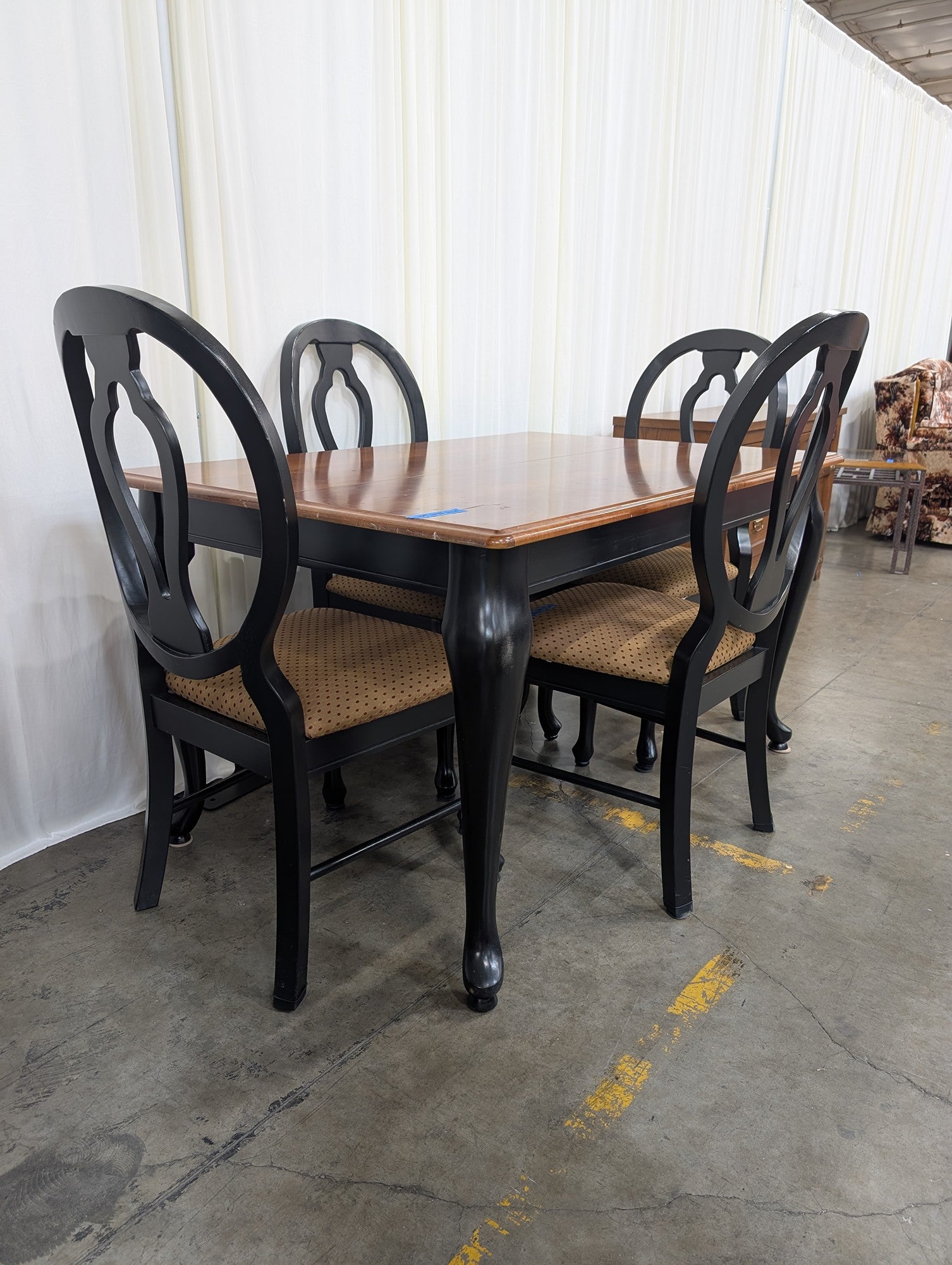 Two-Tone Wood Dining Table with Black Chairs