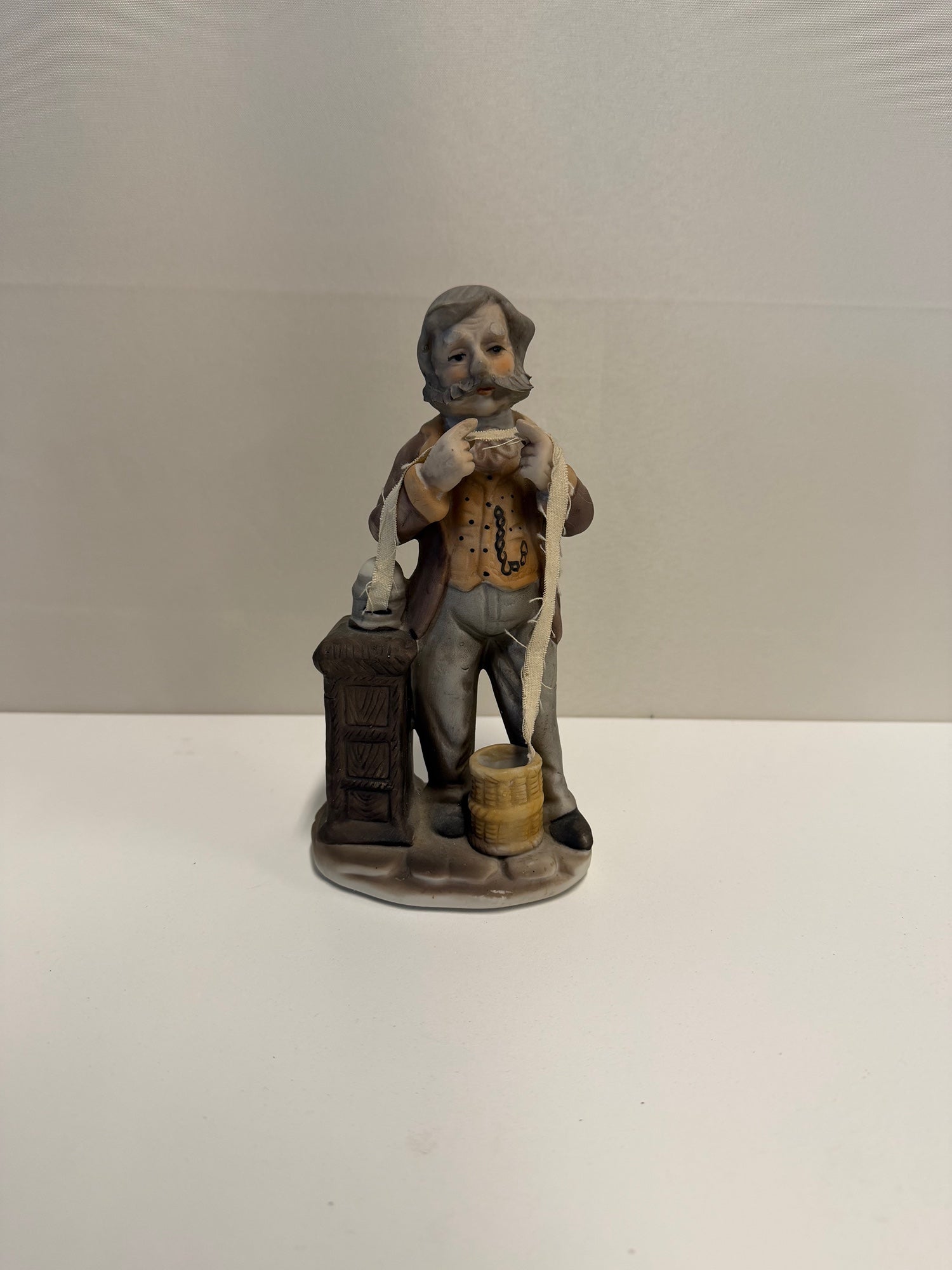Vintage Ceramic Gentleman Figurine with Yarn and Basket