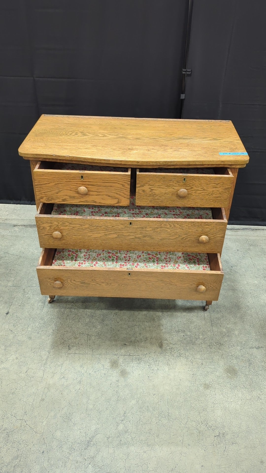 Light Oak Four-Drawer Dresser with Casters