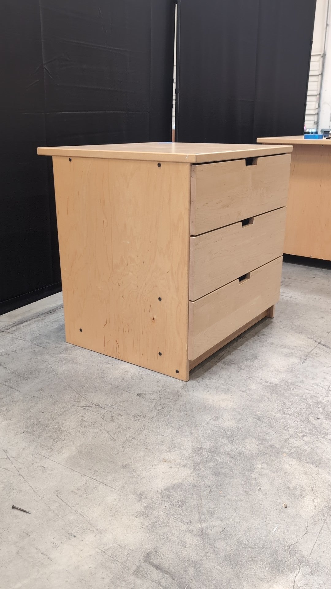 Light Wood Three-Drawer Dresser with Integrated Pulls