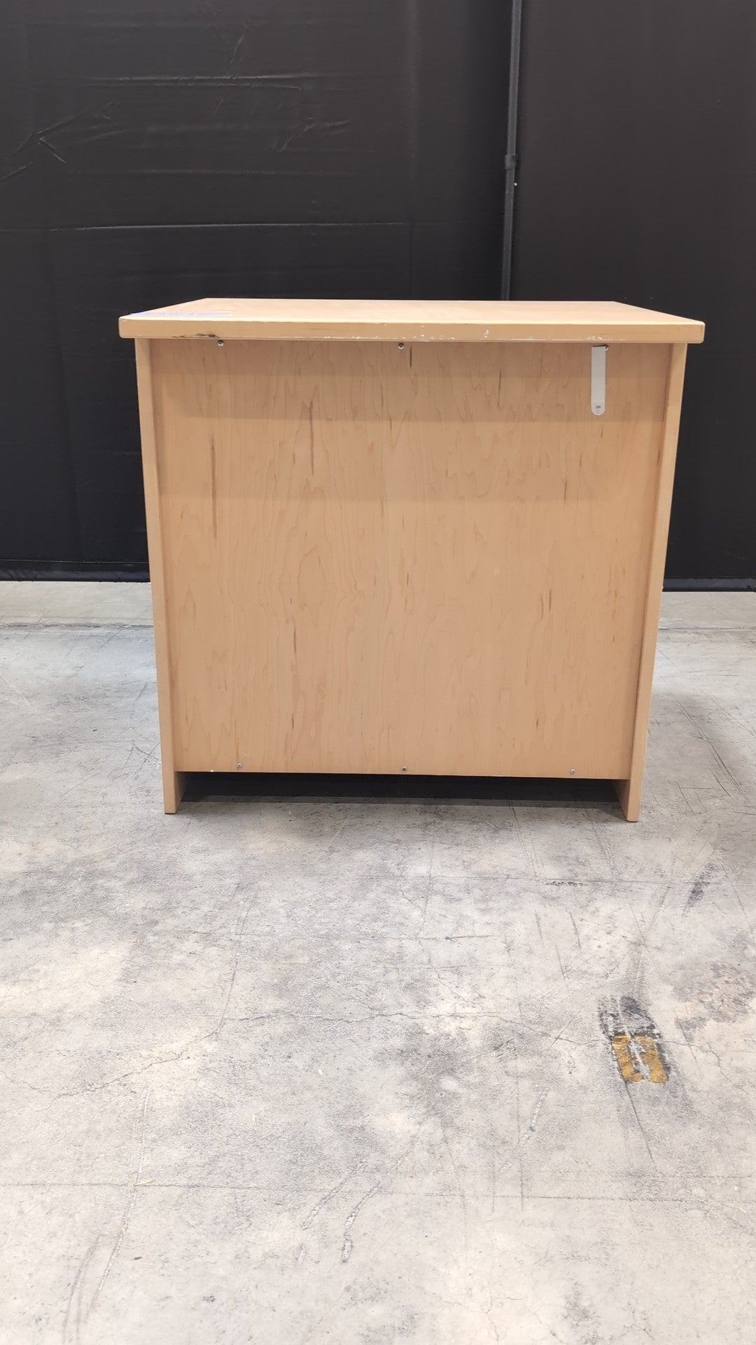 Light Wood Three-Drawer Dresser with Integrated Pulls