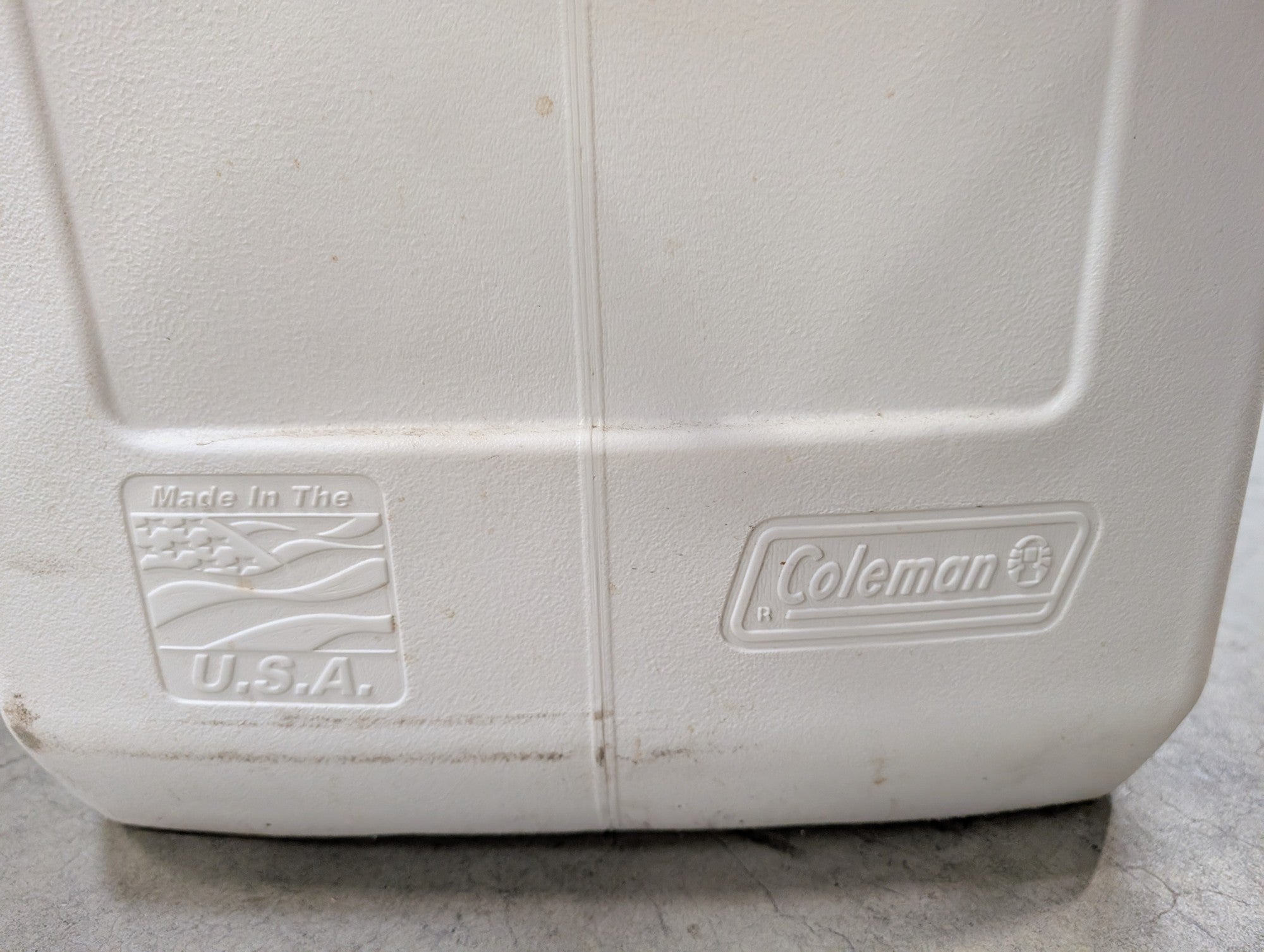 White Coleman Plastic Cooler with Cup Holders