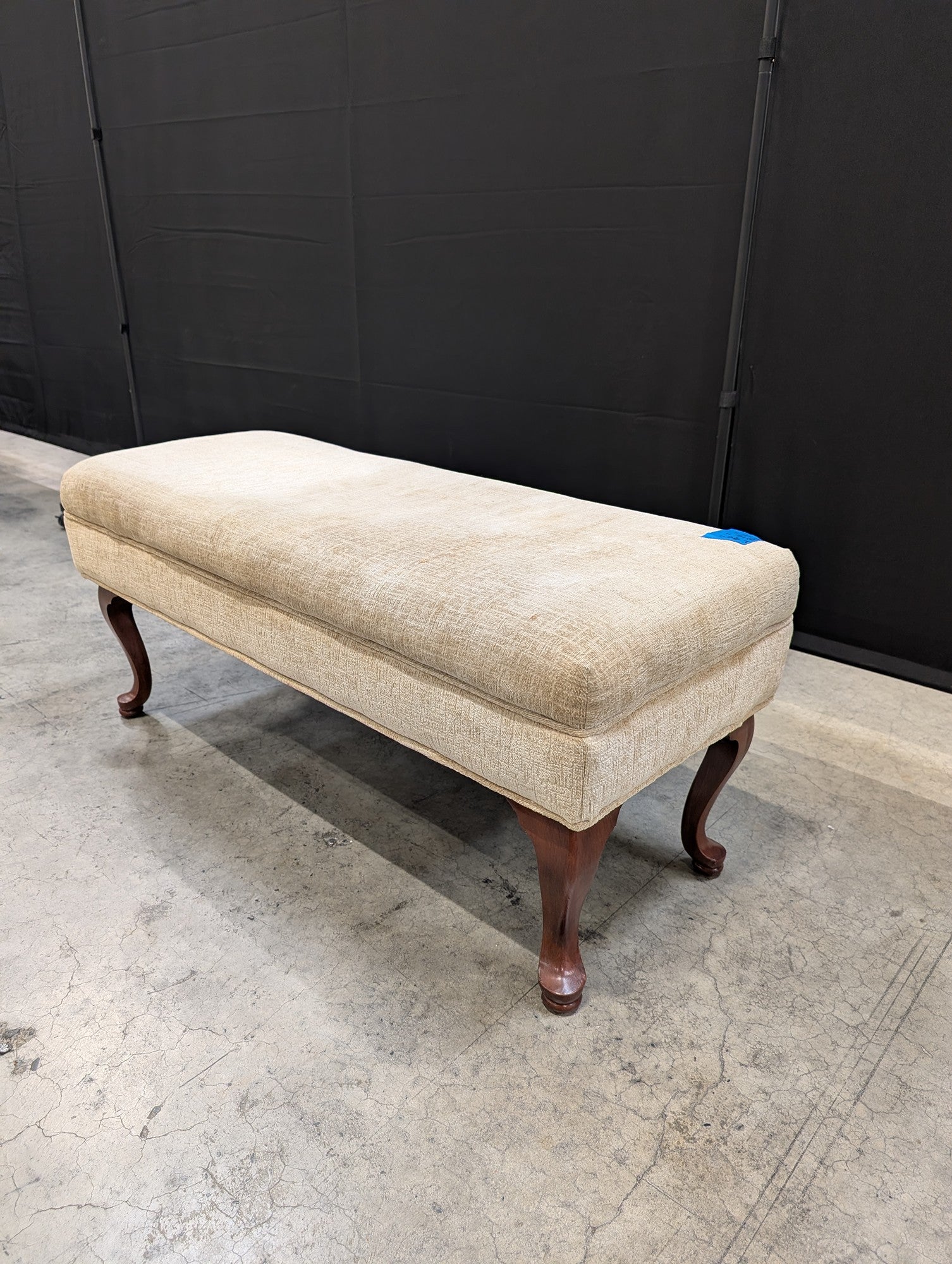 Beige Upholstered Ottoman with Cabriole Legs