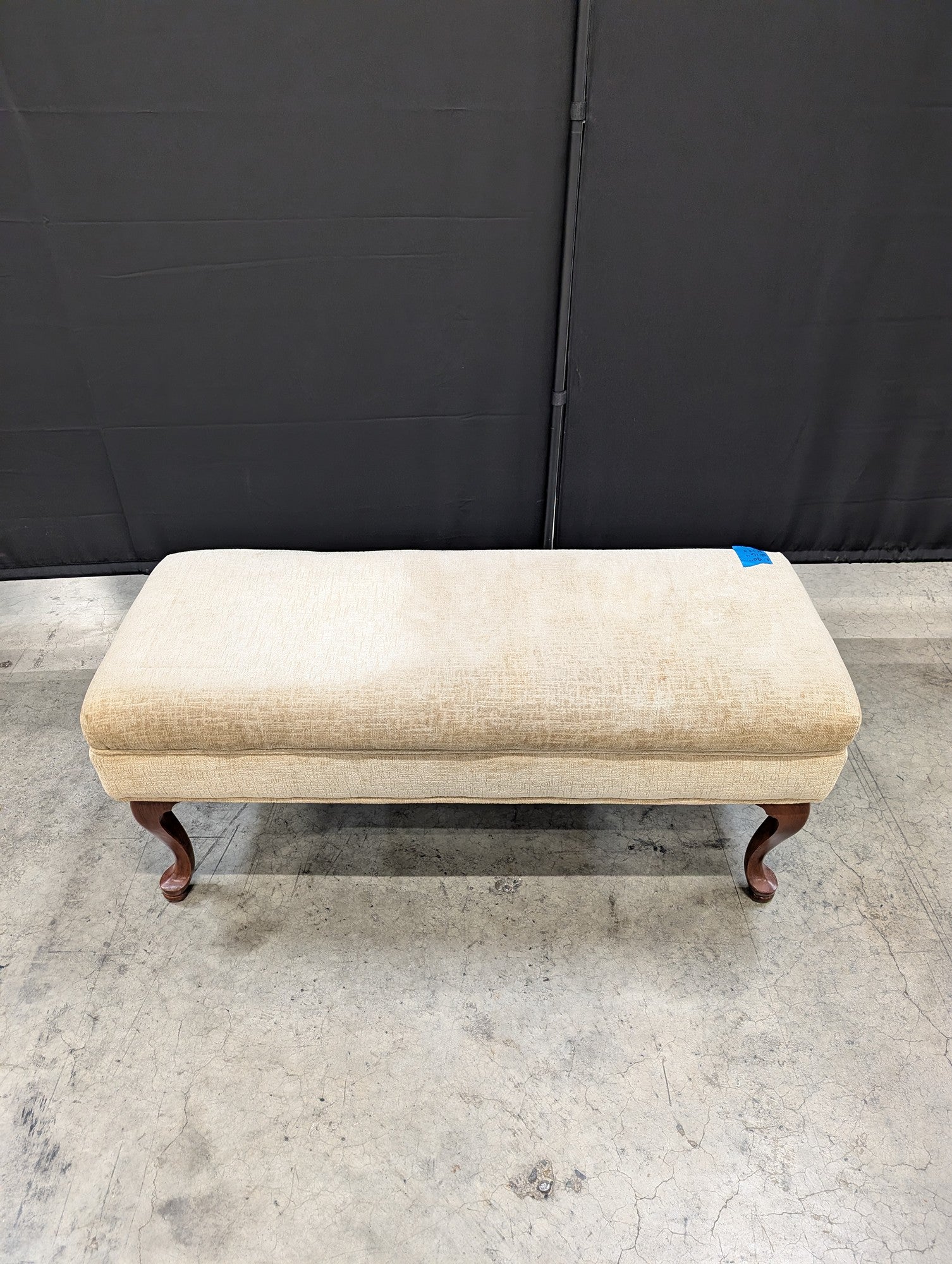 Beige Upholstered Ottoman with Cabriole Legs