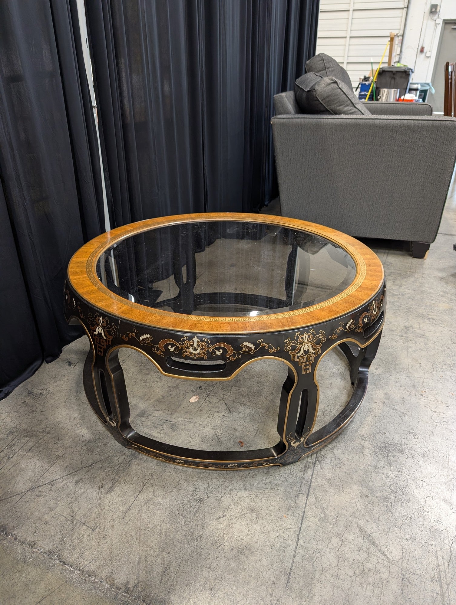 Ornate Black and Gold Round Coffee Table with Glass Top
