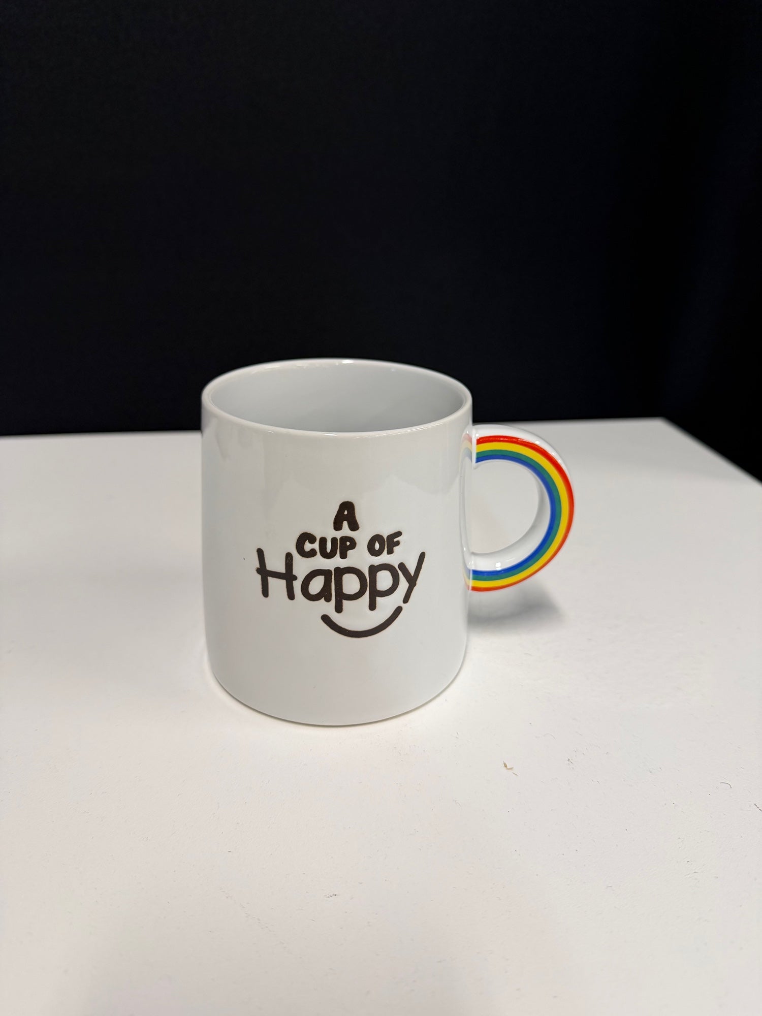 World Market White Ceramic Mug with Rainbow Handle