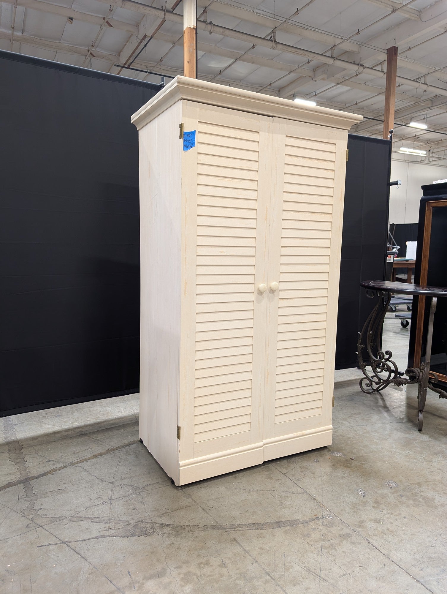 Cream Louvered Door Armoire with Integrated Pull-Out Desk