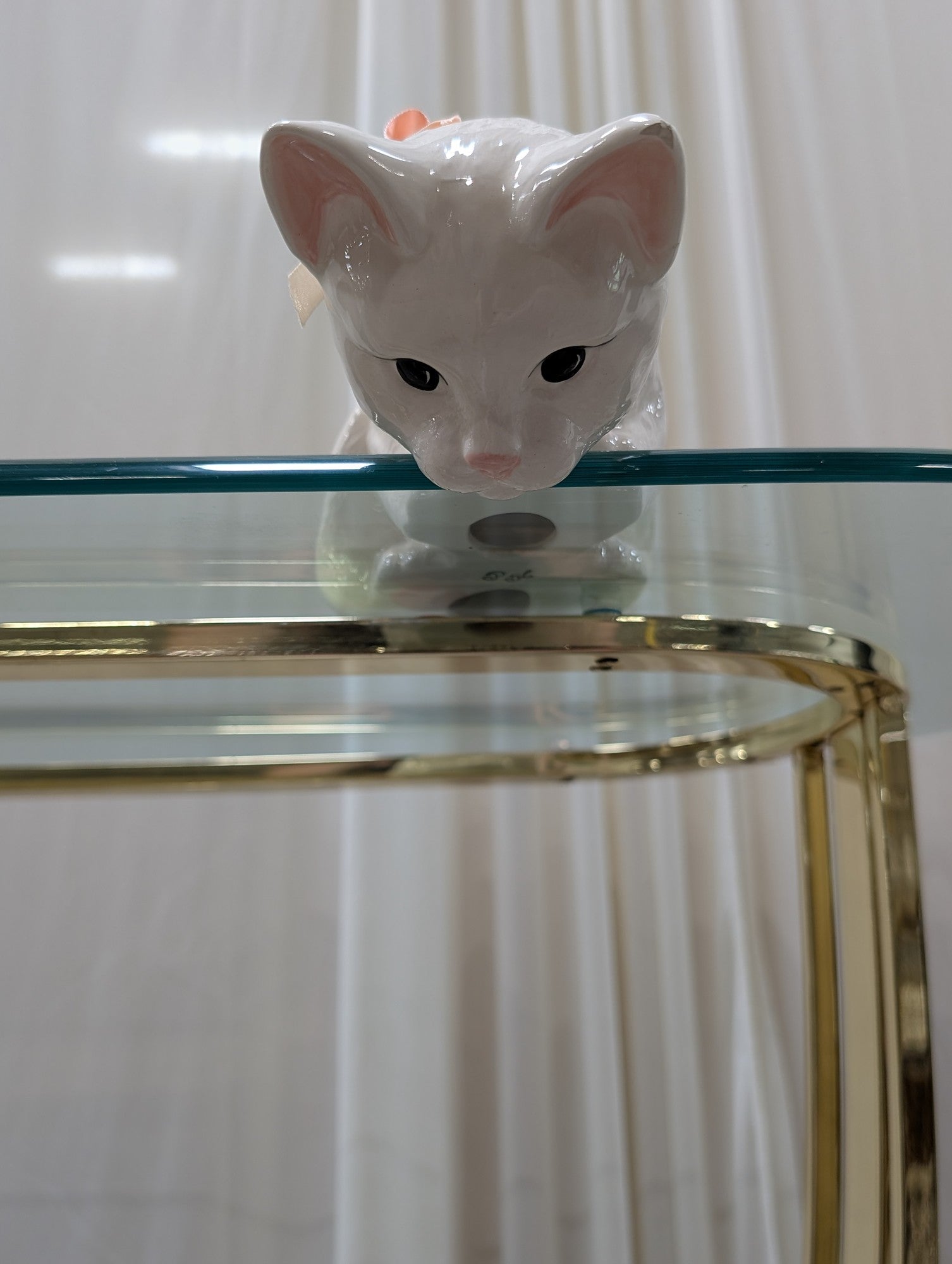 White Ceramic Cat Figurine with Pink Ribbon