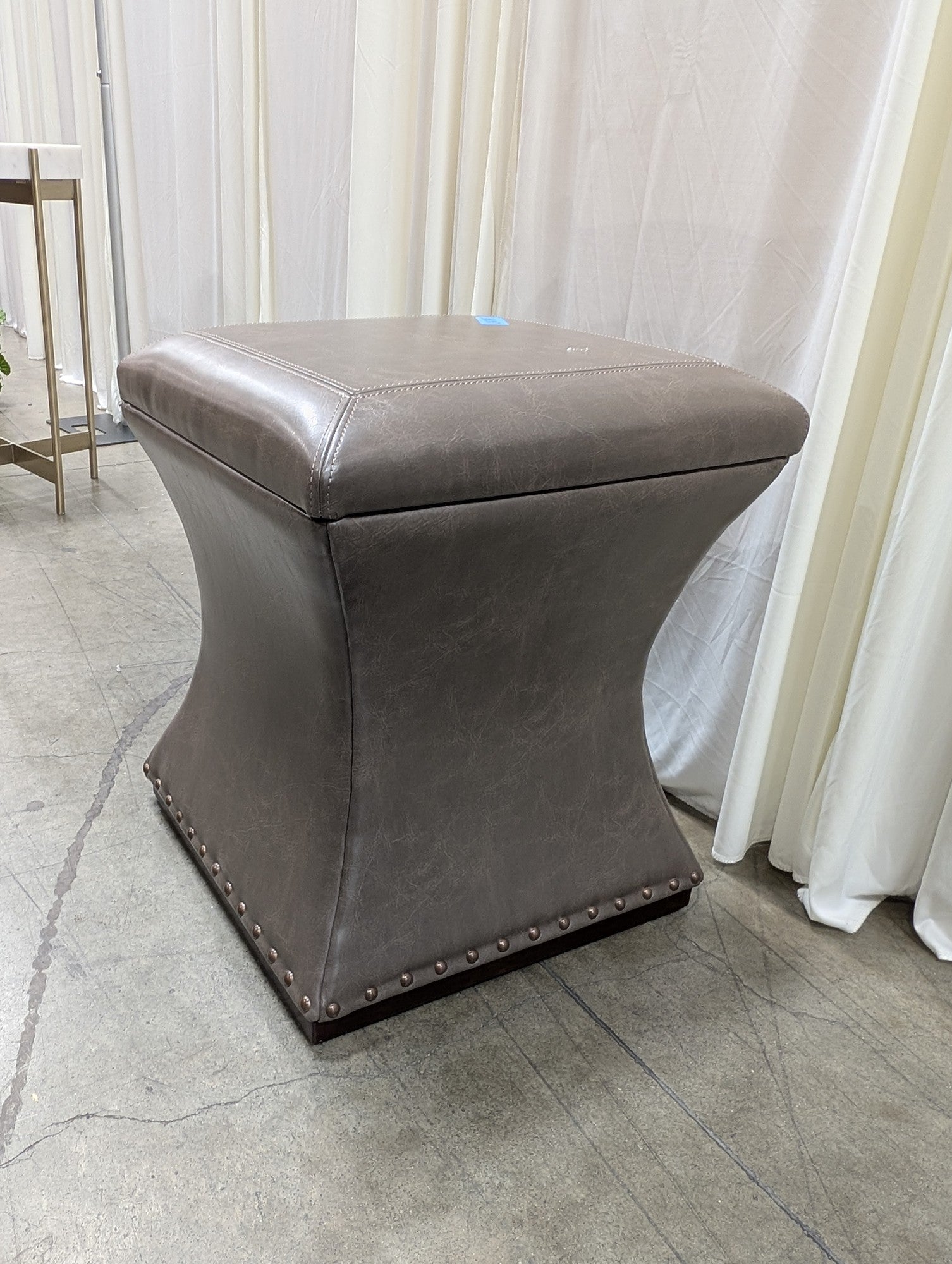 Taupe Faux Leather Ottoman with Nailhead Trim