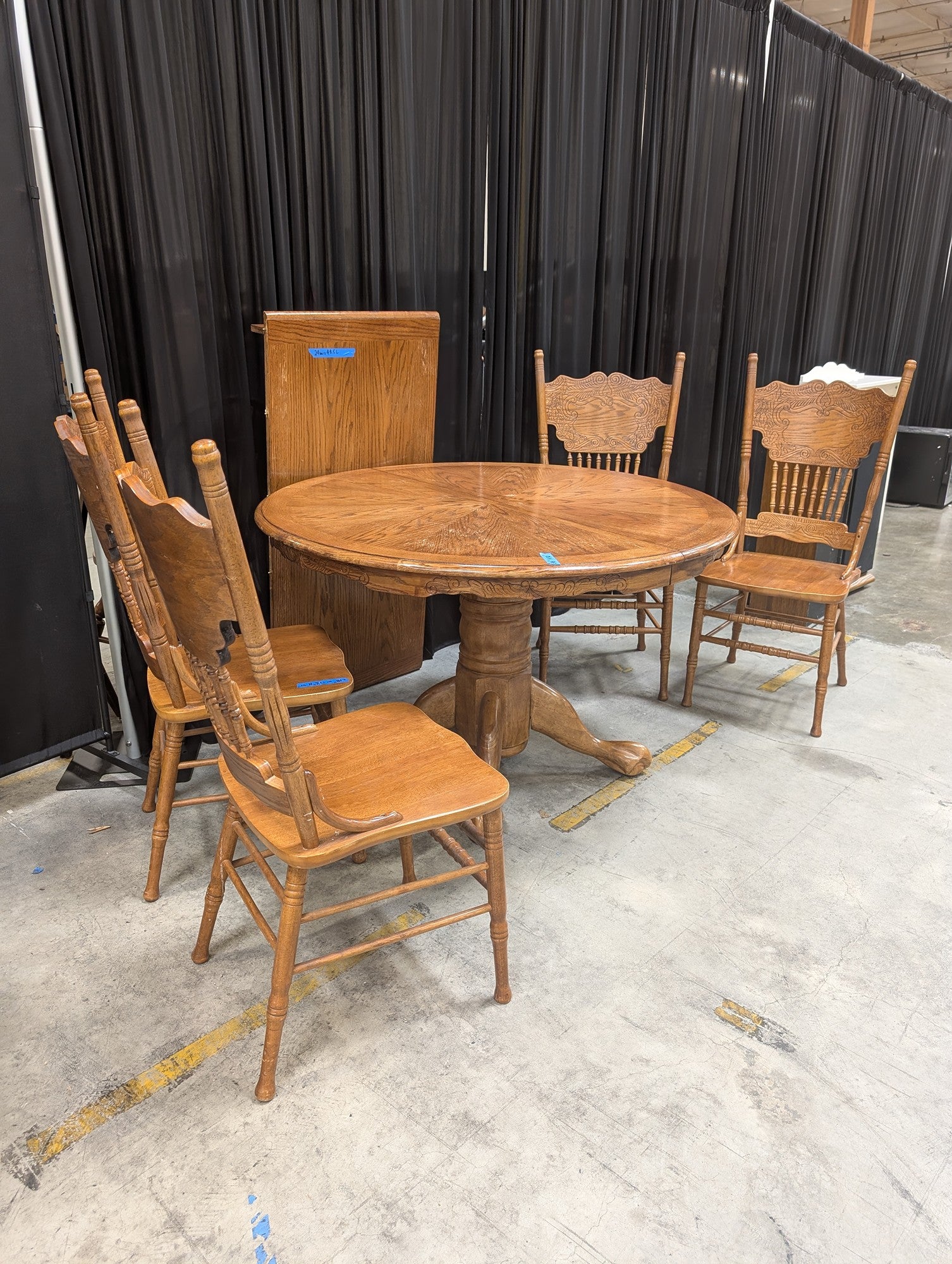 Oak-Tone Pedestal Wood Dining Table with Four Carved Chairs