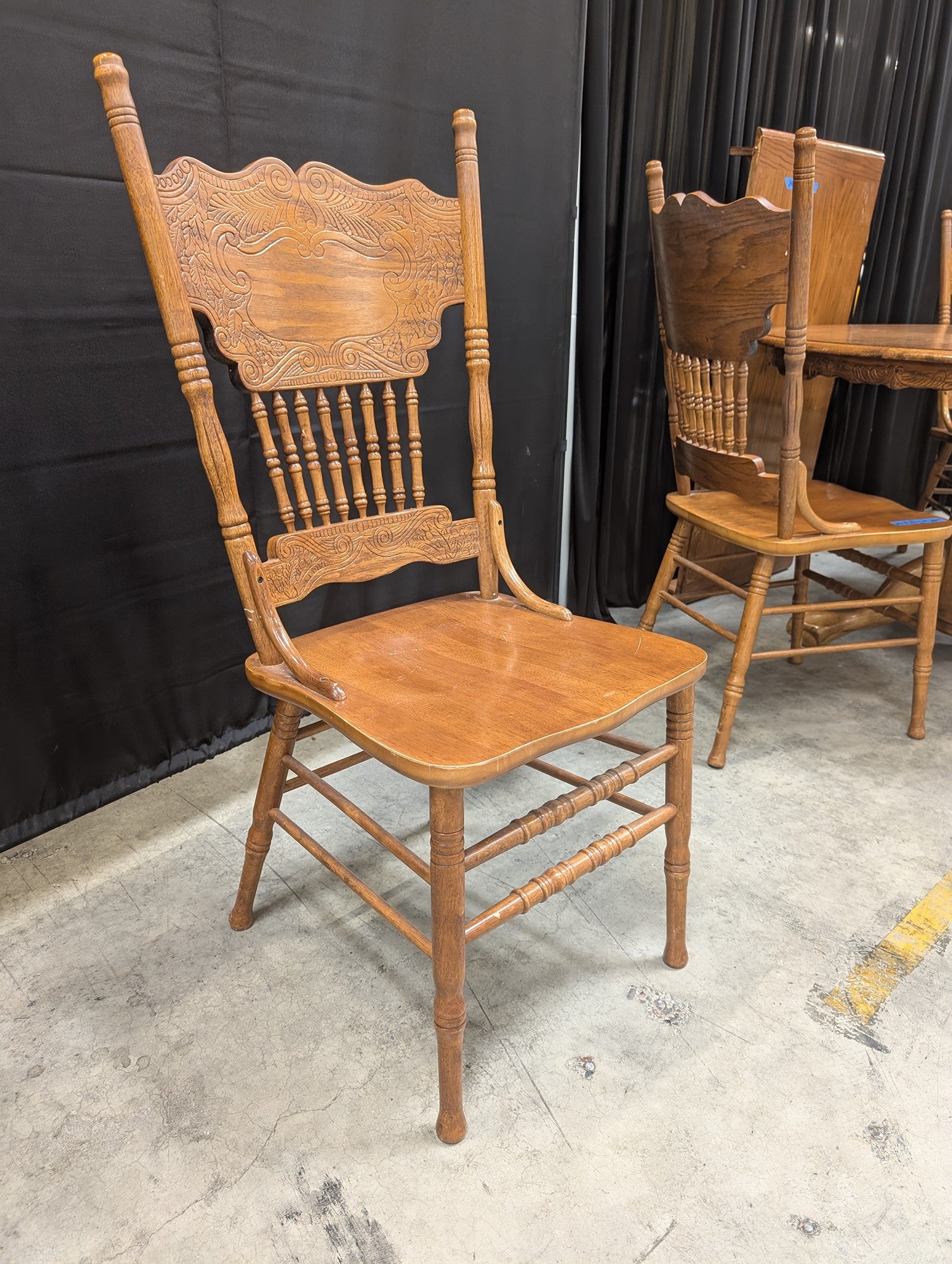 Oak-Tone Pedestal Wood Dining Table with Four Carved Chairs