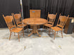 Oak-Tone Pedestal Wood Dining Table with Four Carved Chairs