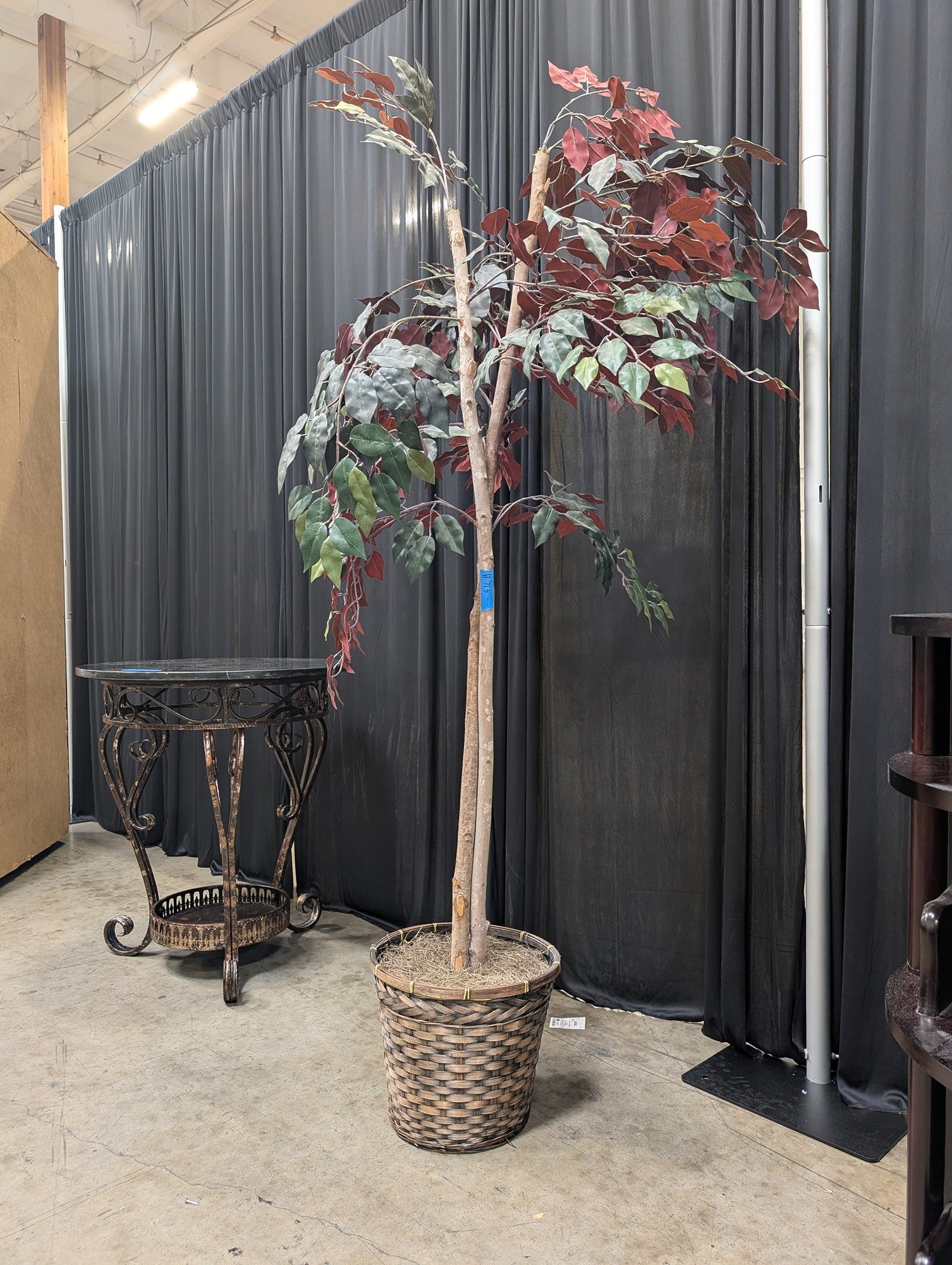 Green and Burgundy Artificial Tree in Woven Basket