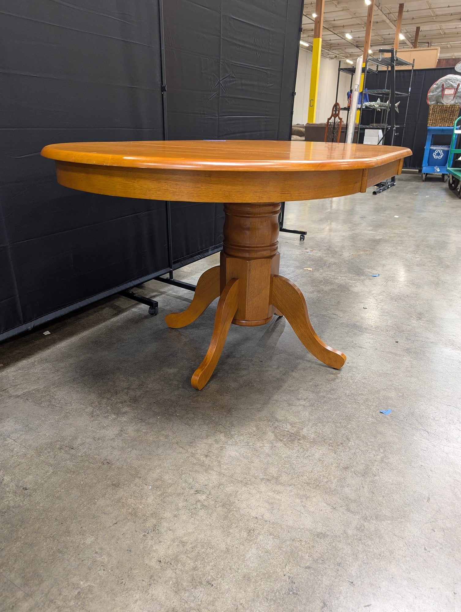 Oval Pedestal Dining Table in Warm Wood