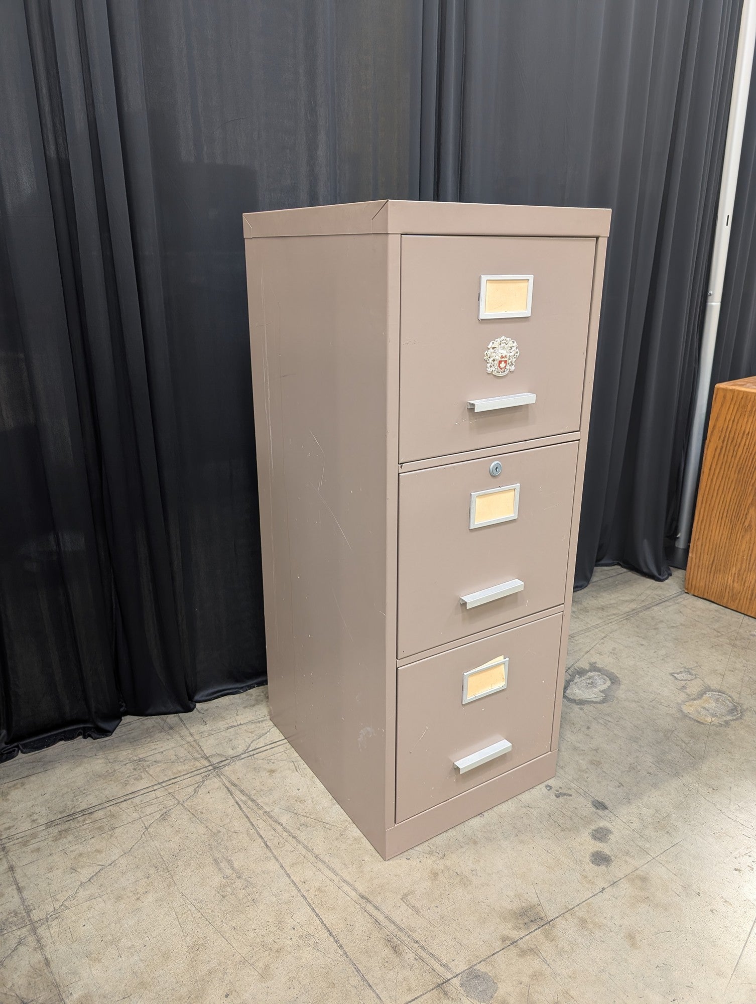 Tan Metal Three-Drawer Filing Cabinet with missing key