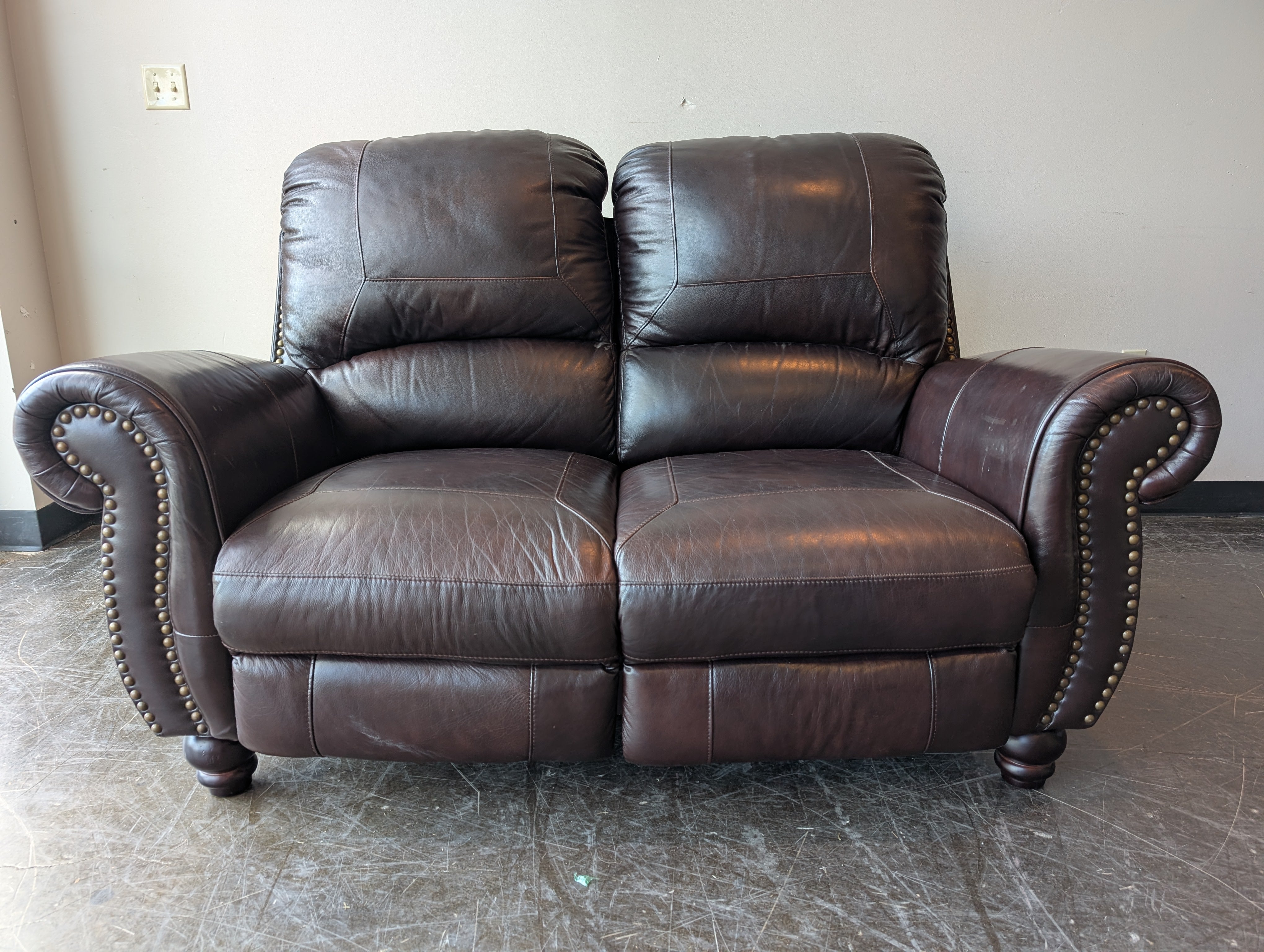 Classic Dark Brown Leather Reclining Loveseat with Nailhead Trim