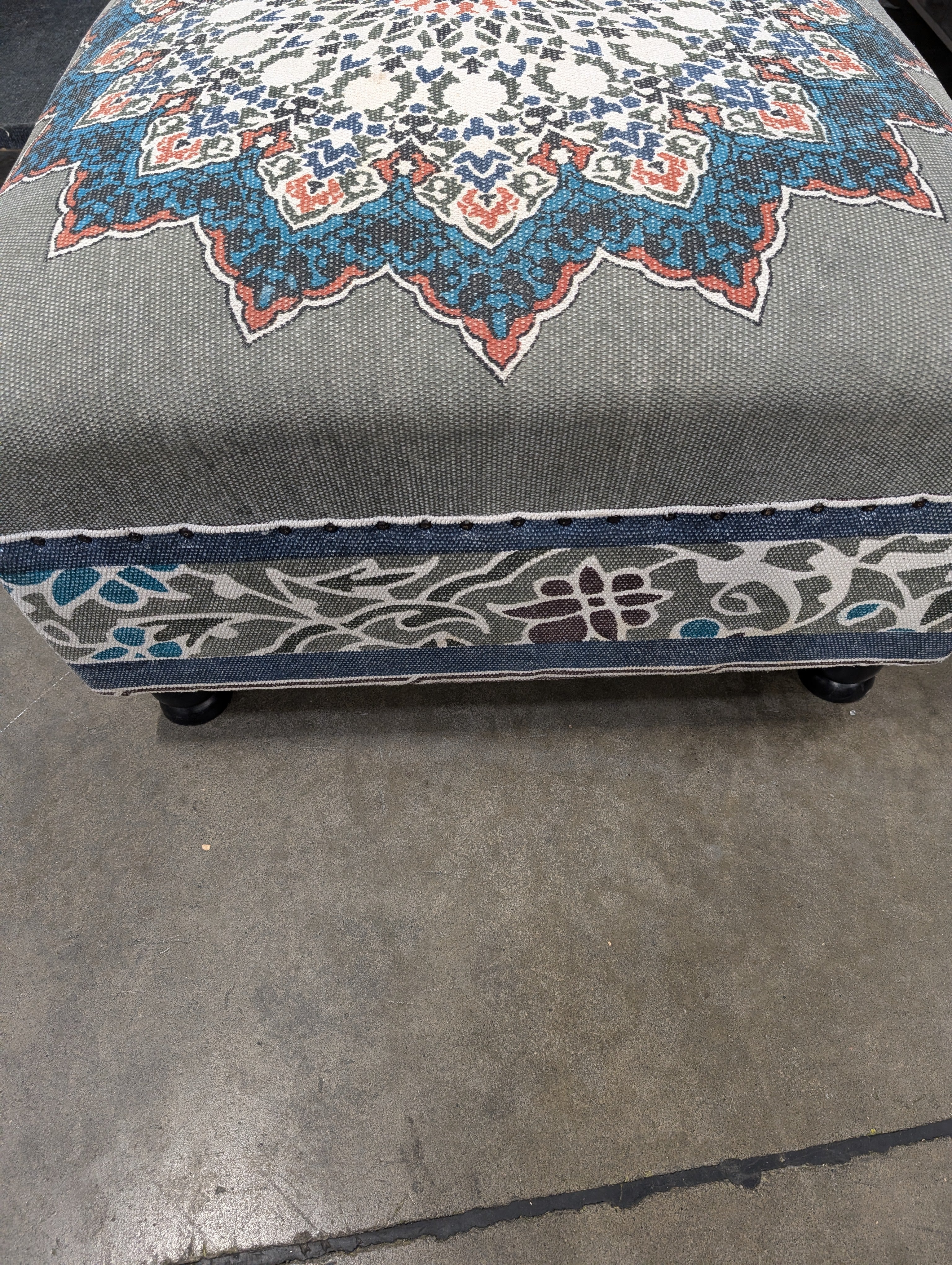 Decorative Upholstered Ottoman with Medallion Pattern and Nailhead Trim