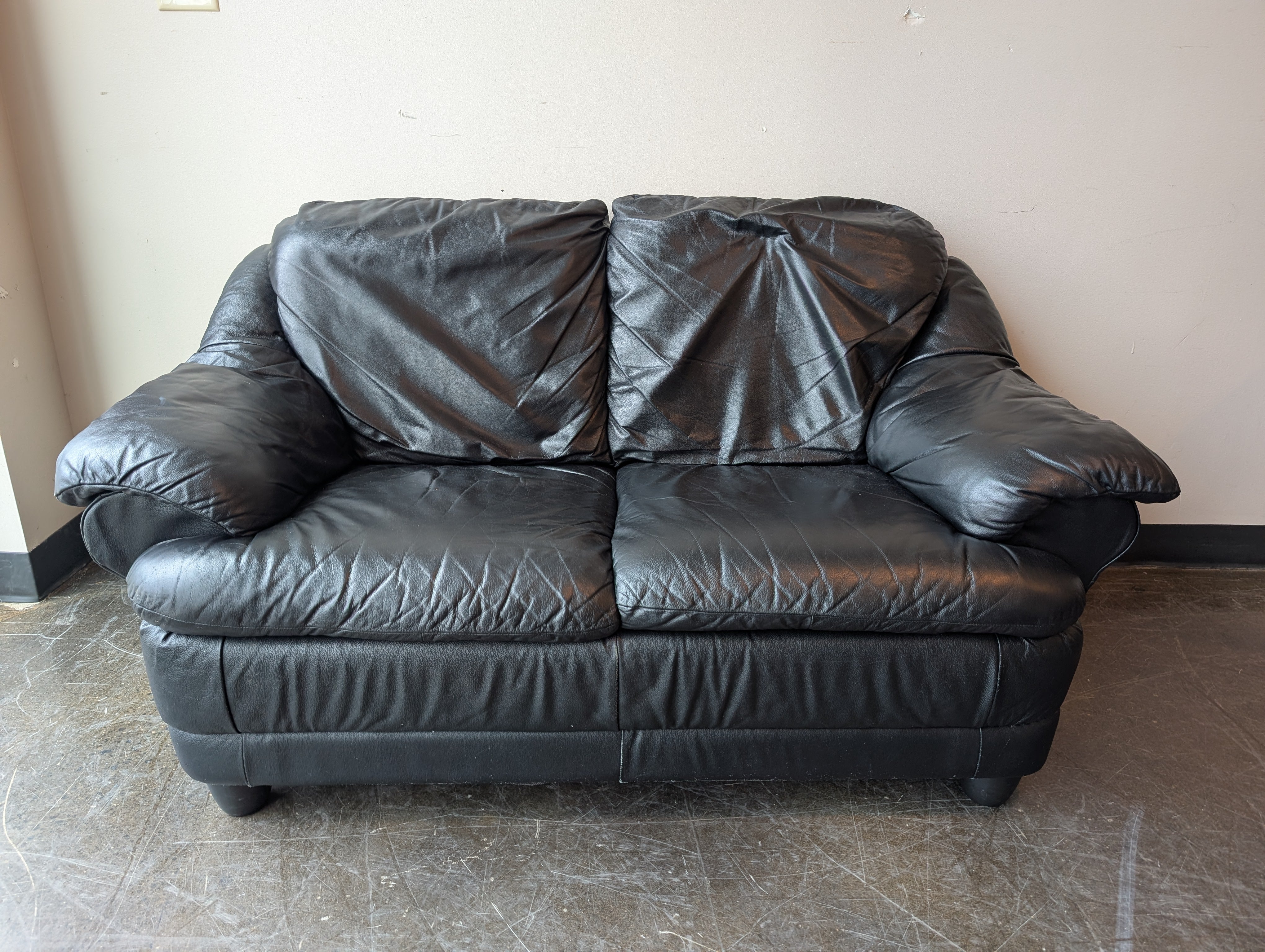 Spacious Black Leather Loveseat