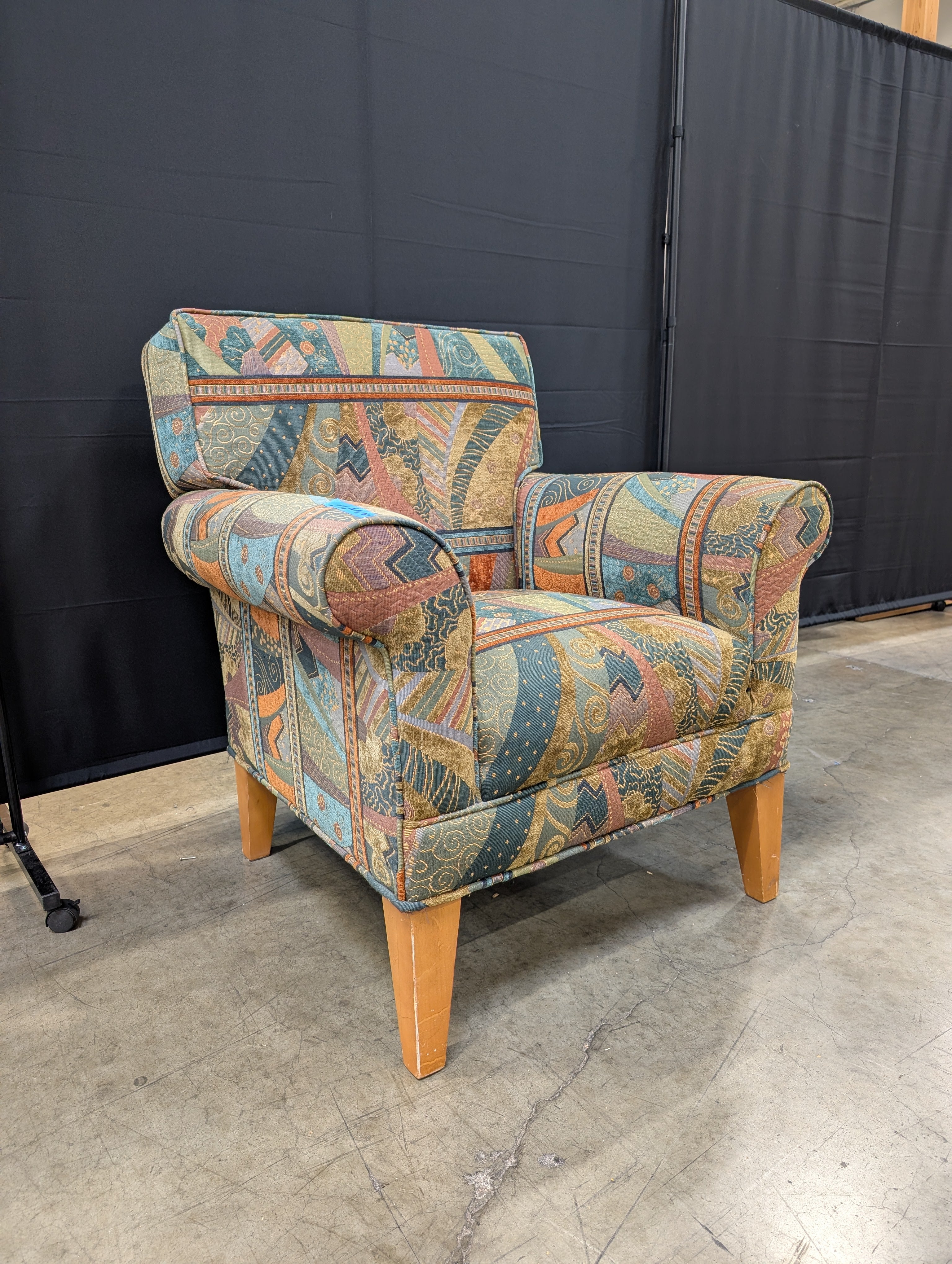 Vibrant Multi-Color Upholstered Armchair Cushion with Eclectic Pattern