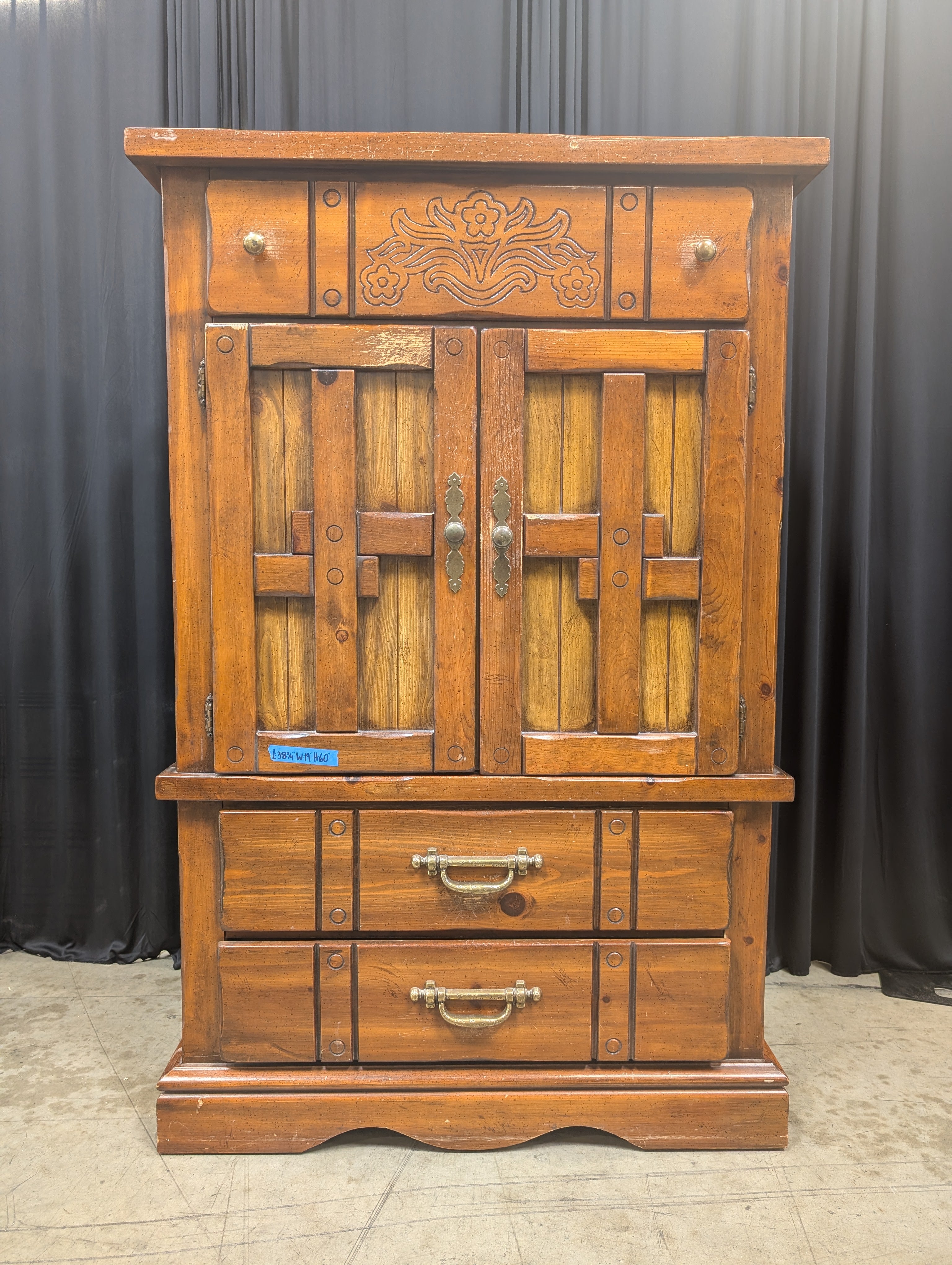 Rustic Brown Wood Armoire with Carved Details