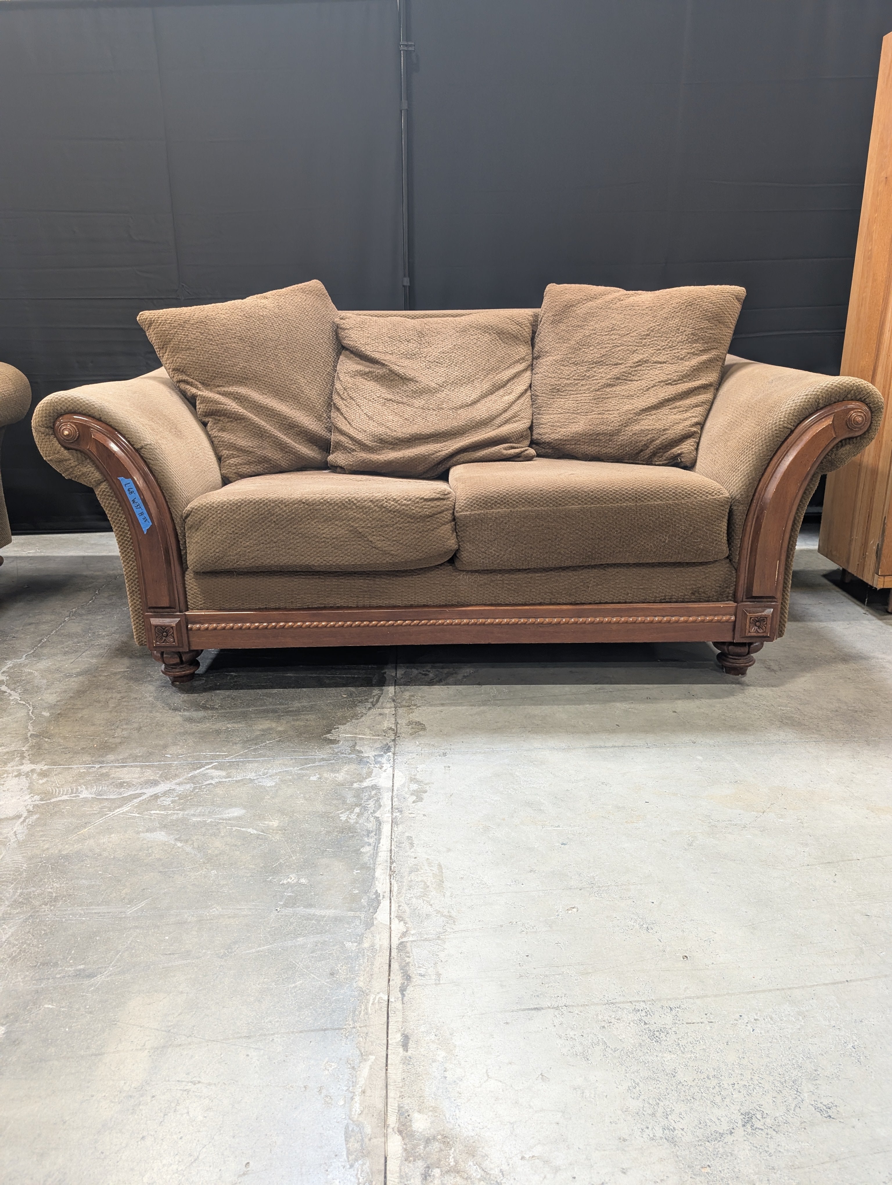 Brown Textured Fabric Loveseat with Wood Trim