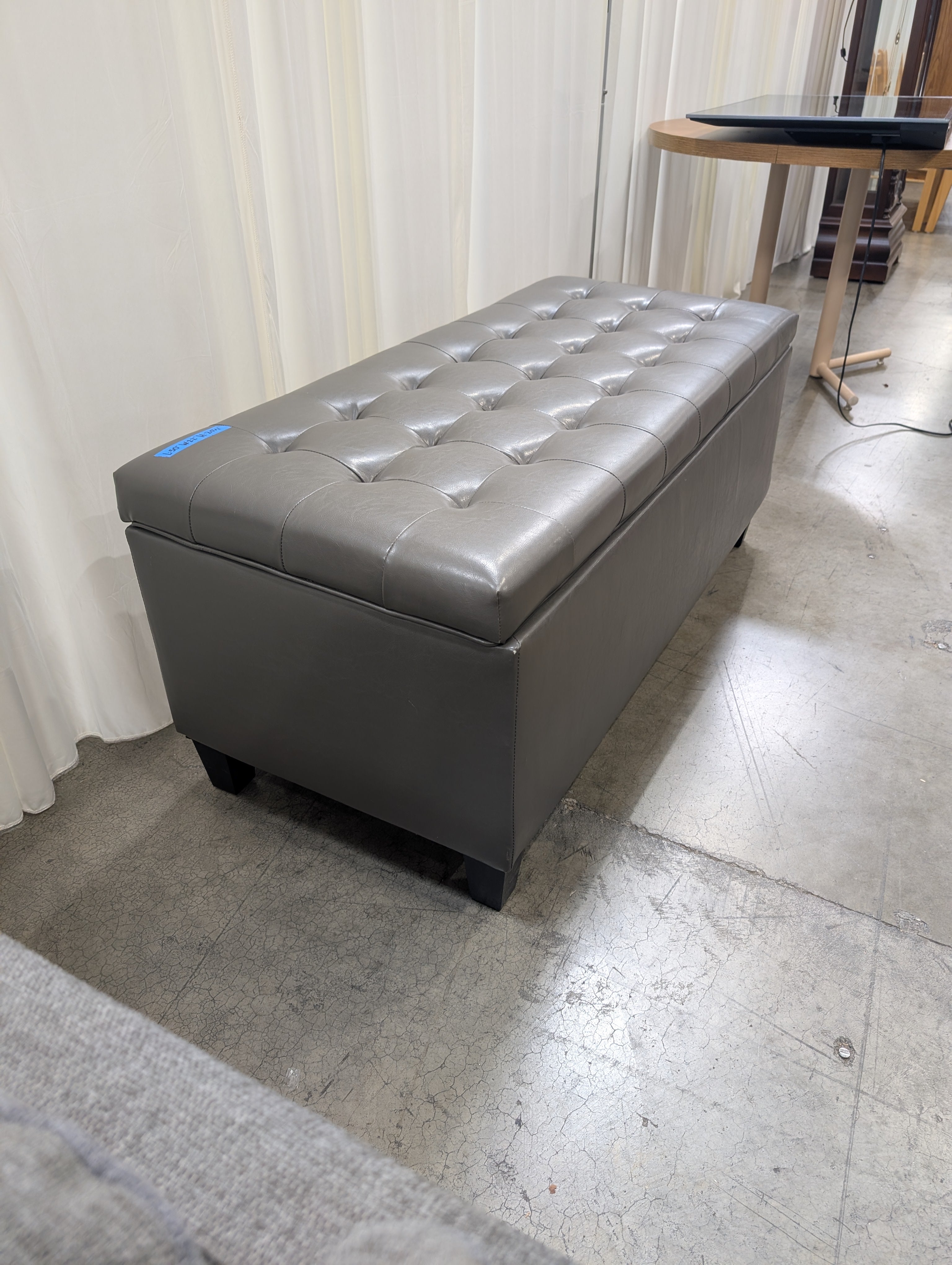 Charcoal Tufted Storage Ottoman in Faux Leather