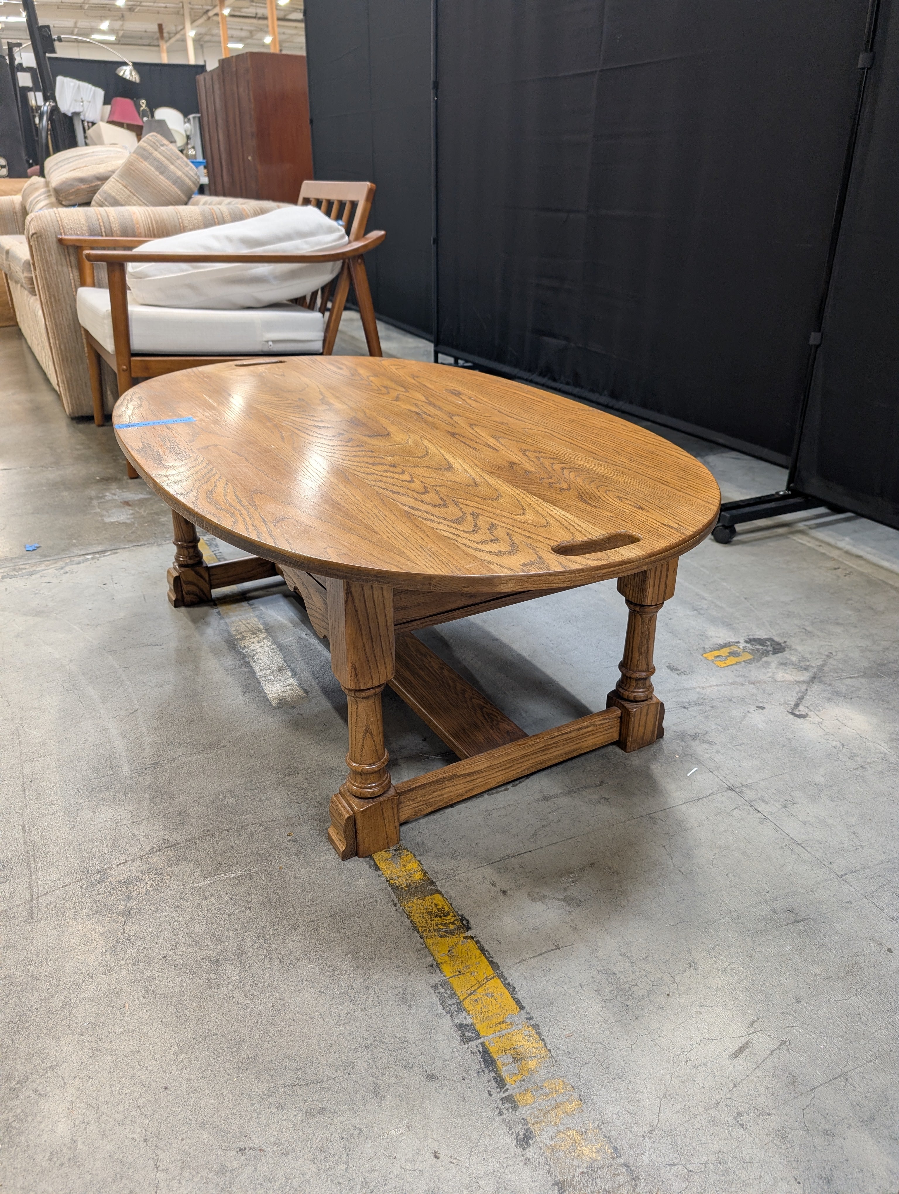 Oval Light Brown Wood Coffee Table with Cut-Out Handles
