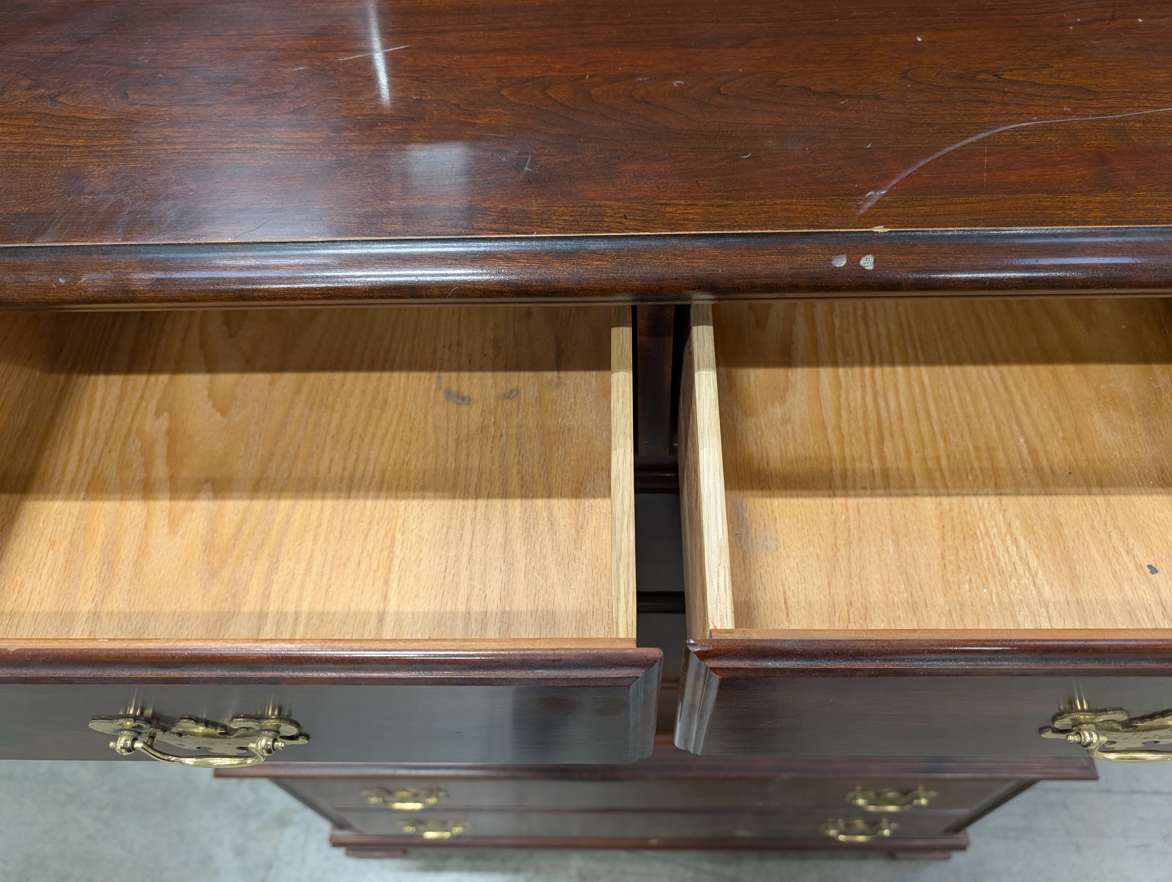 Traditional Dark Wood Chest of Drawers with Ornate Brass Pulls